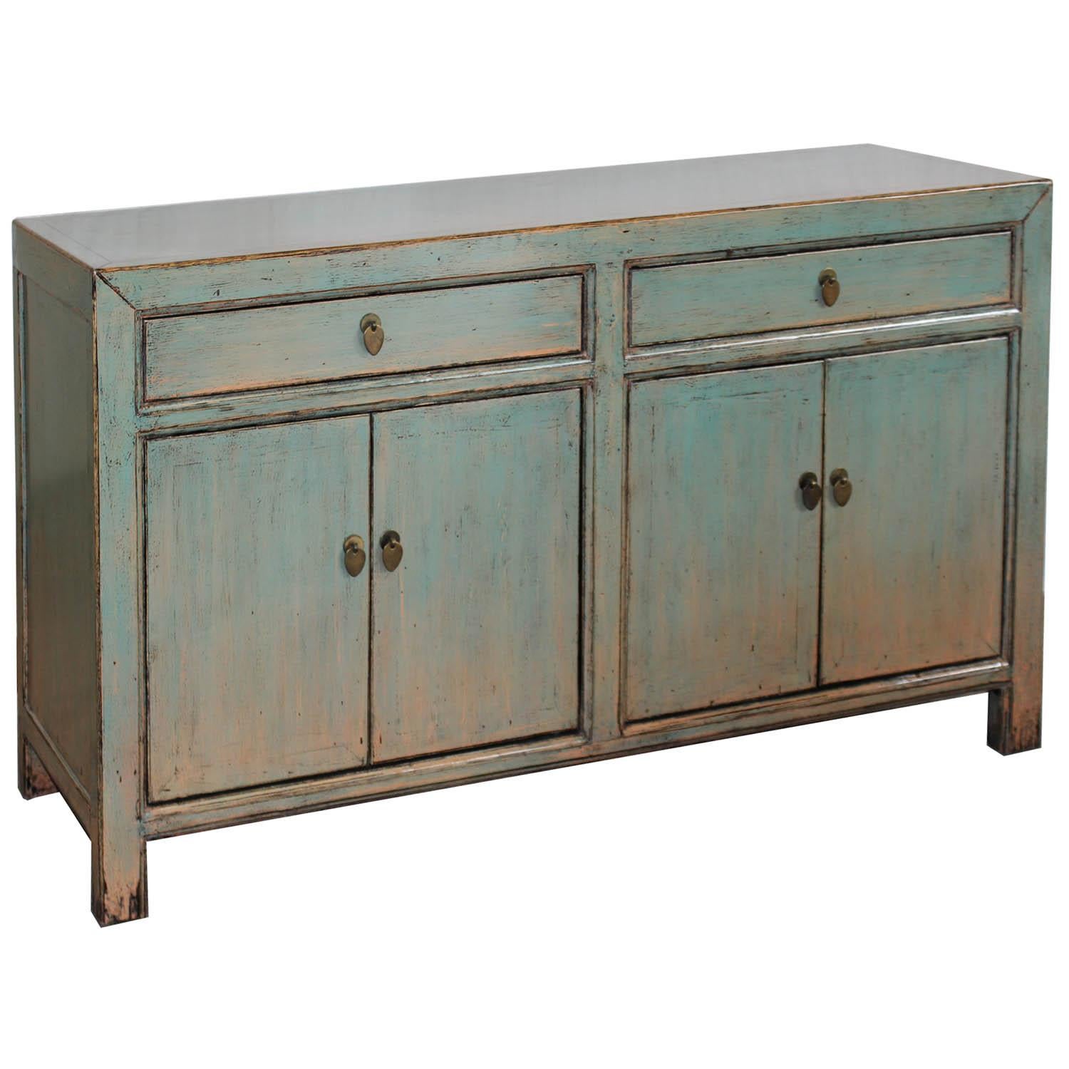 Contemporary green/blue lacquer buffet with two drawers and clean lines can be used in an entry way or living room beneath artwork.