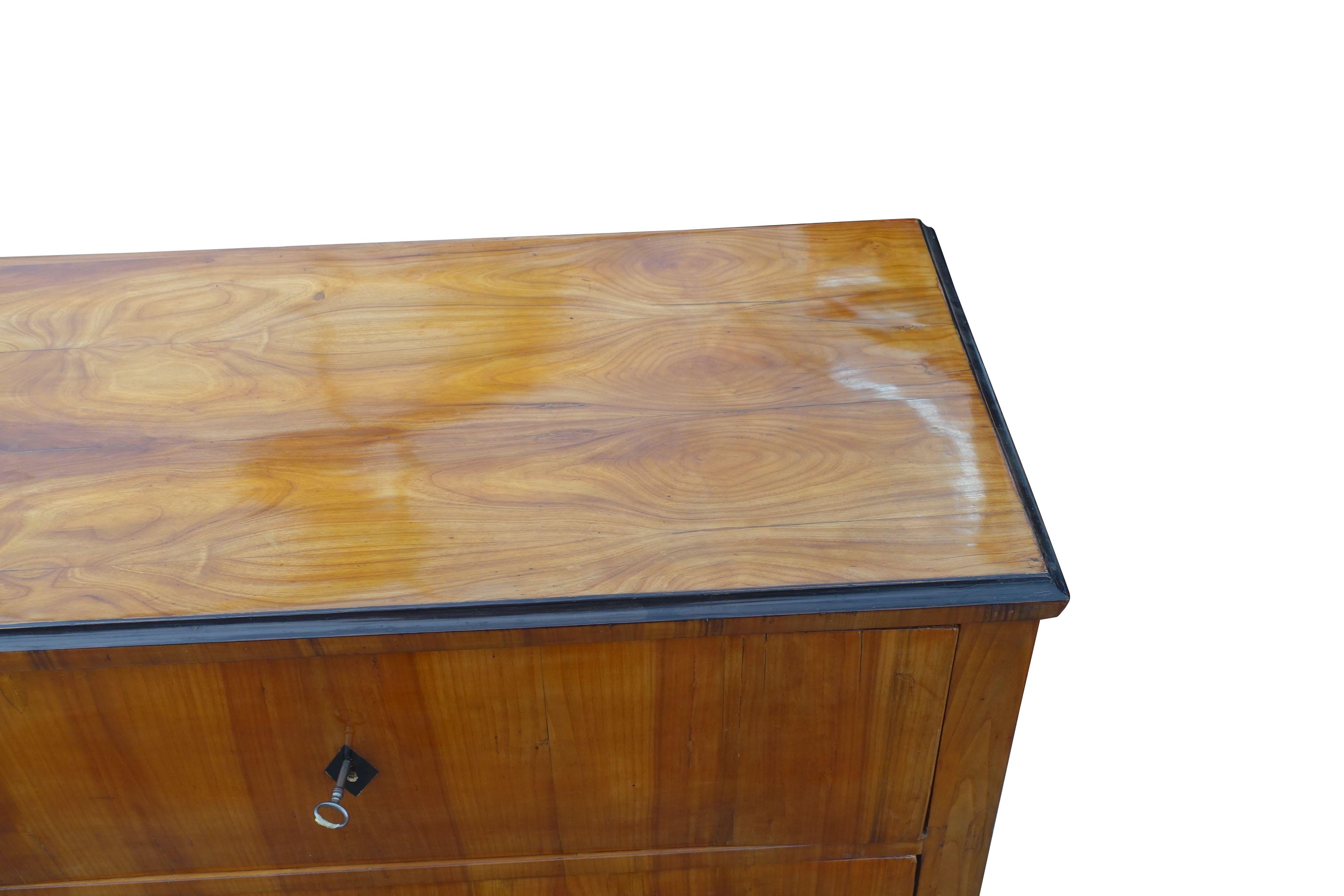 19th century highly polished sycamore two-drawer commode.
Ebonized diamond design key surround.
Beautifully polished to accentuate wood grain design.
 