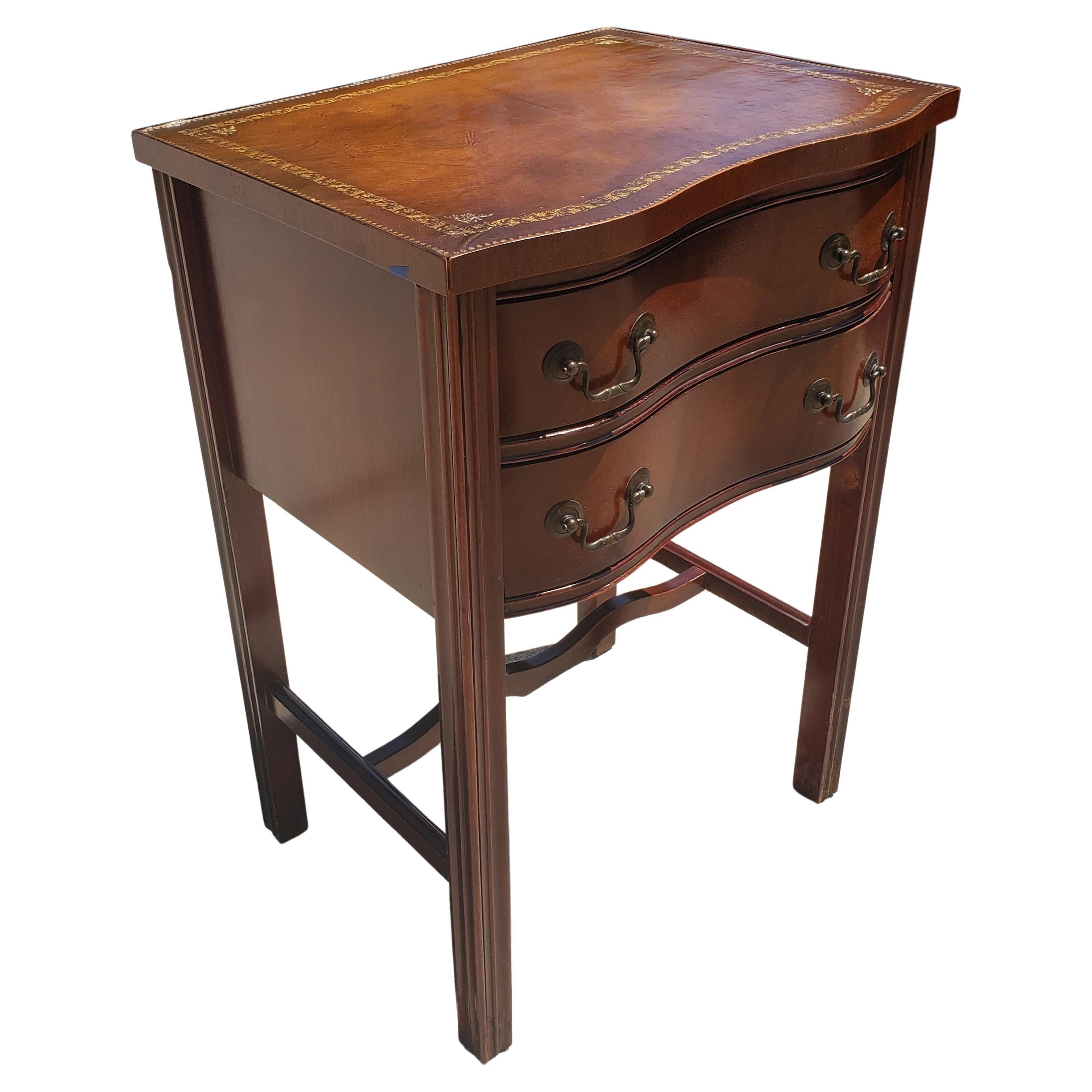 1940s Vintage Chippendale 2-drawer mahogany side table with Stinciled leather top. Good vintage condition with age patina on leather. 
Measures 19