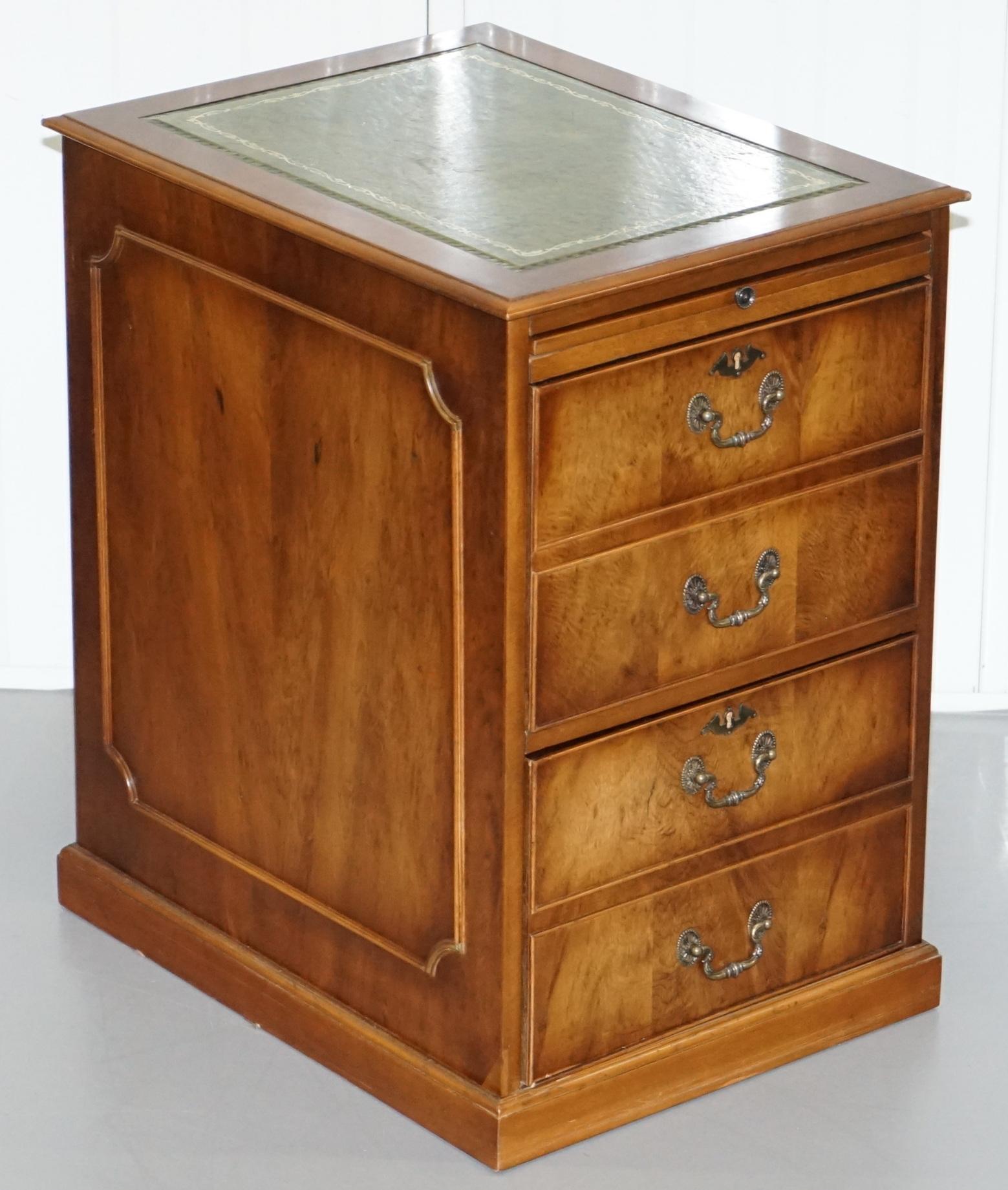 We are delighted to offer for sale this lovely large Burr Walnut with green leather gold tooled writing surface two drawer filing cabinet with rare butlers serving tray

The green leather writing surface is gold tooled and it has a nice vintage