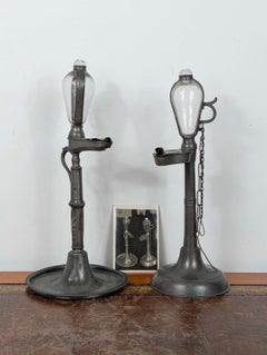 Two Early 19th Century Oil Lamp Clocks with Glass and Pewter Detailing