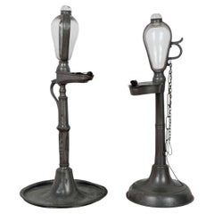 Two Early 19th Century Oil Lamp Clocks with Glass and Pewter Detailing