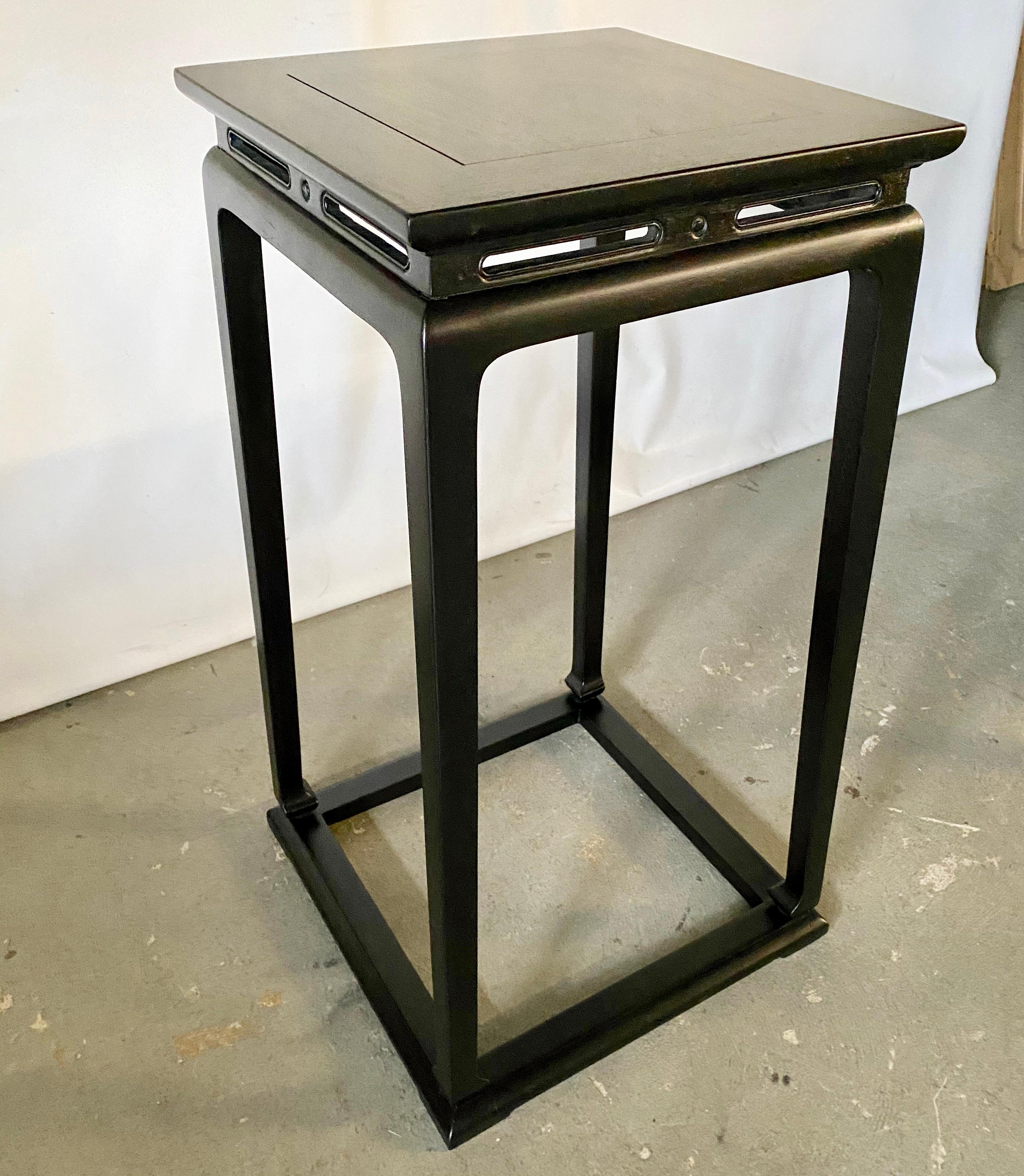 Add class and elegance with these highly stylish sculpture or plant stands in ebonized black. The sleek styling lends itself to be used in various styles of decor. Wonderful statement in an entry foyer, dining or living room.