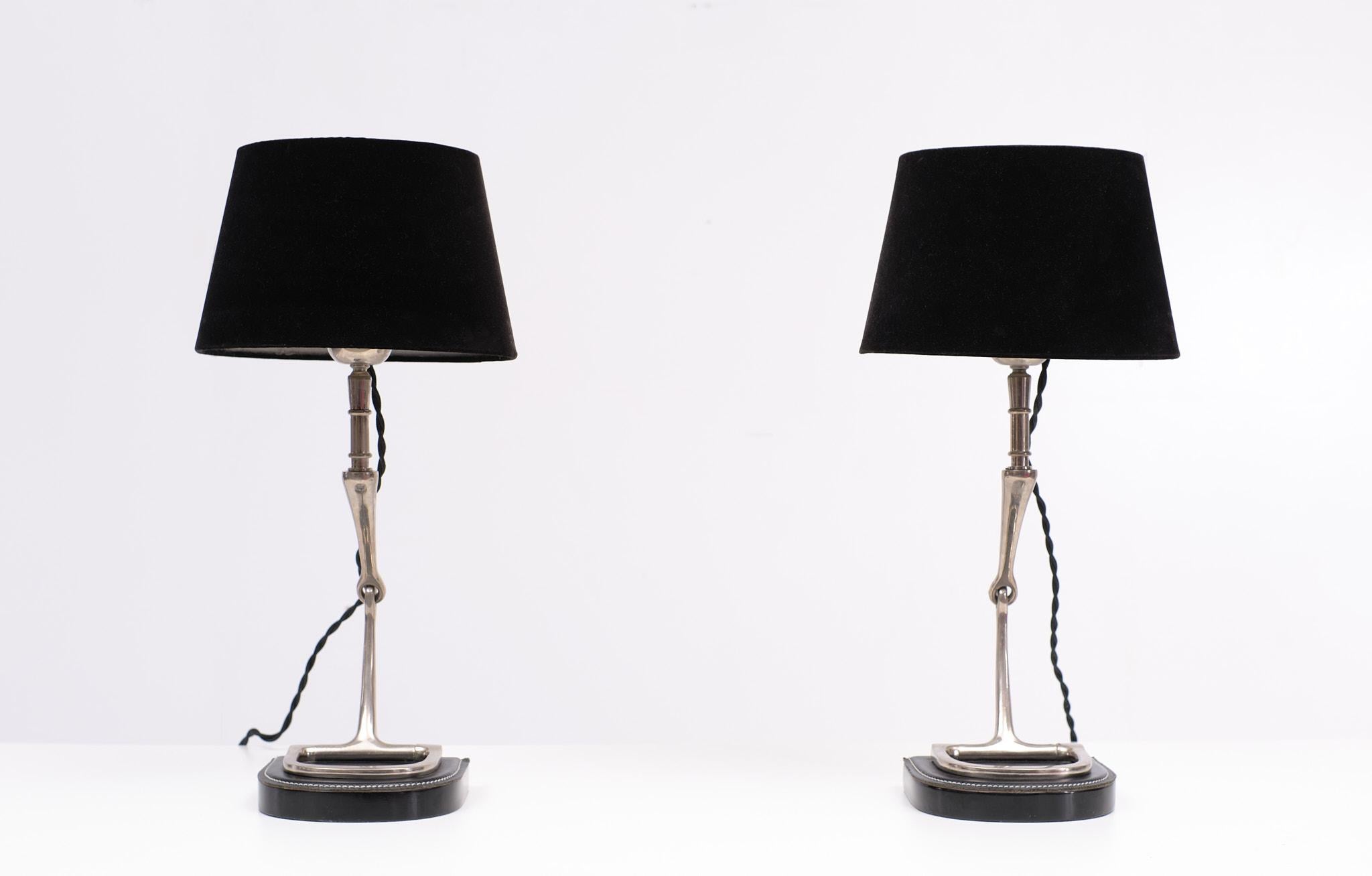 Two exceptional table lamps Chrome stirrups on a stich leather base, comes 
with Black Velvet shades. So stylish. Large E27 bulb needed. Manufactured 
by quality firm Eicholtz Netherlands, 1980s.