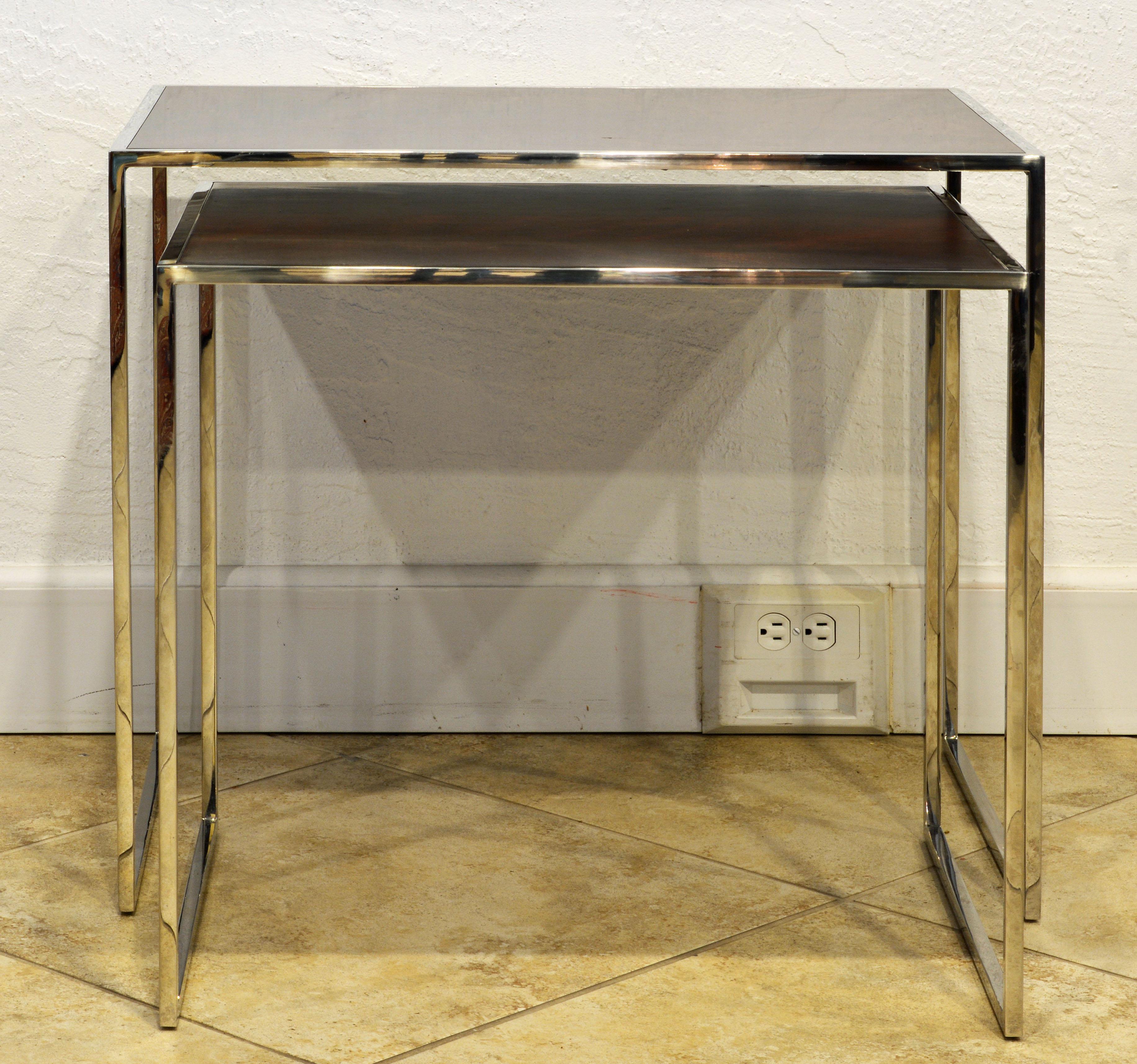 The tables features panel Santos Rosewood tops set in frames of polished stainless steel. A very elegant design by Michael Kirkpatrick who is known also for being leading designer for Ralph Lauren and Calvin Klein. The smaller table bears the Decca