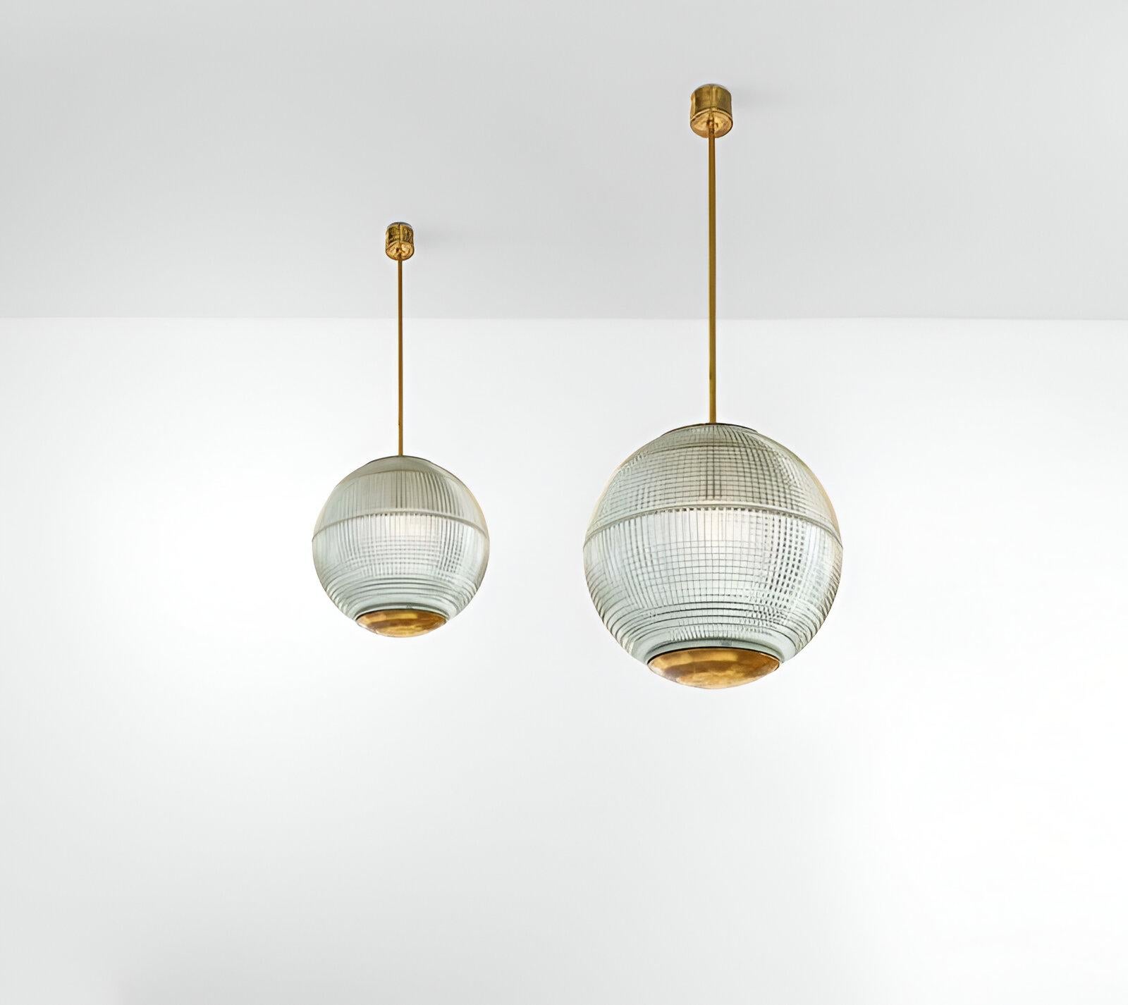 These suspension lamps feature an elegant metal structure that enhances their fine French Design while their exquisite moulded glass diffusers delicately disperse light, creating a warm and inviting glow. These elegant lamps perfectly complete any