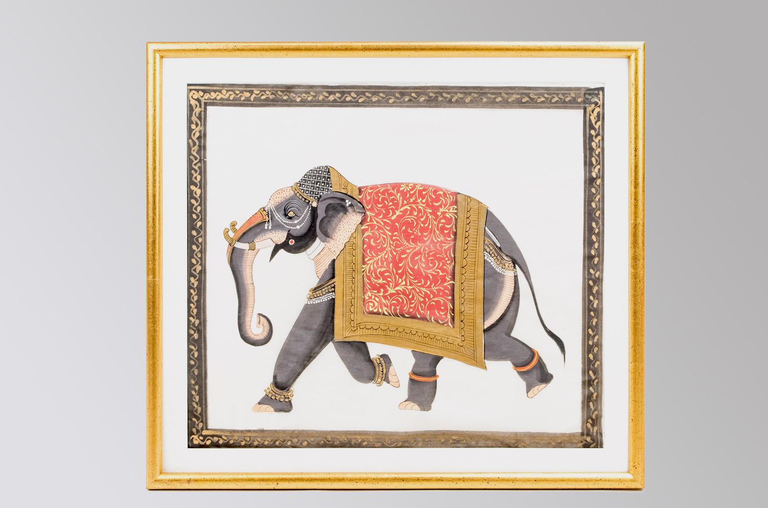 Two mixed techniques on paper figuring two oriental style elephants walking, both wearing jewels on the head, the trunk, tusks and paws. They are wearing a pad with a gilt edge, one with a red background and decor of gilt scrolls and the other with