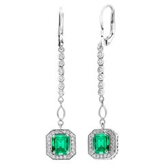 Two Emeralds Weighing 2.40 Carats Halo Diamond Lever Back White Gold Earrings