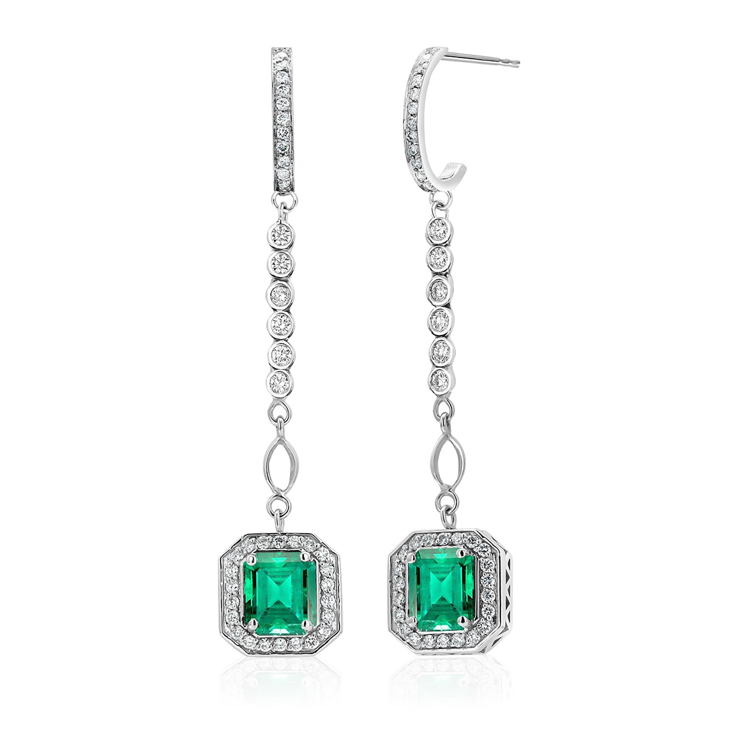 Women's or Men's Emerald Shaped Emeralds Halo Diamond 3.50 Carat Lariat Gold 2.20 Inch Earrings For Sale