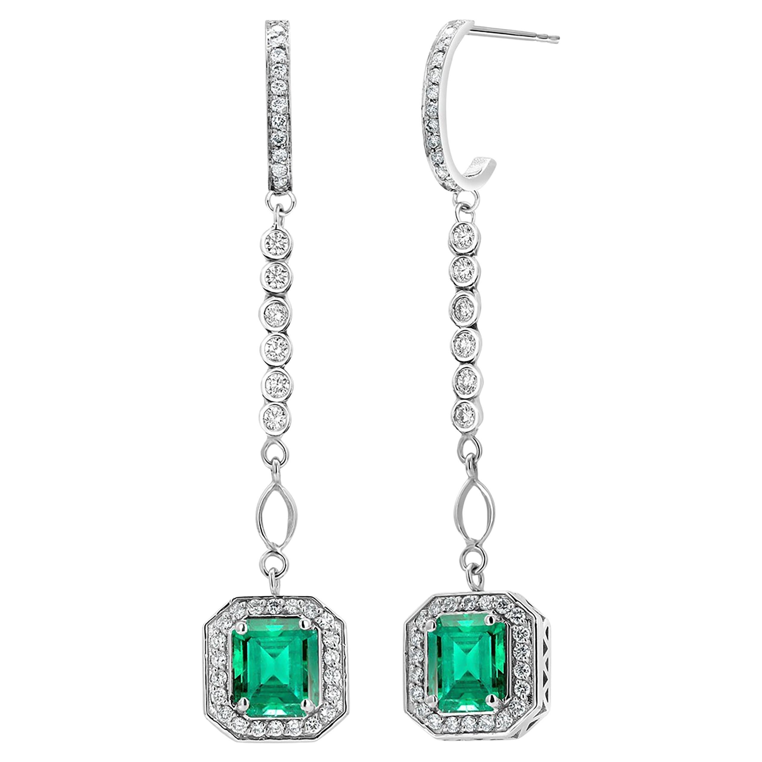 Emerald Shaped Emeralds Halo Diamond 3.50 Carat Lariat Gold 2.20 Inch Earrings For Sale