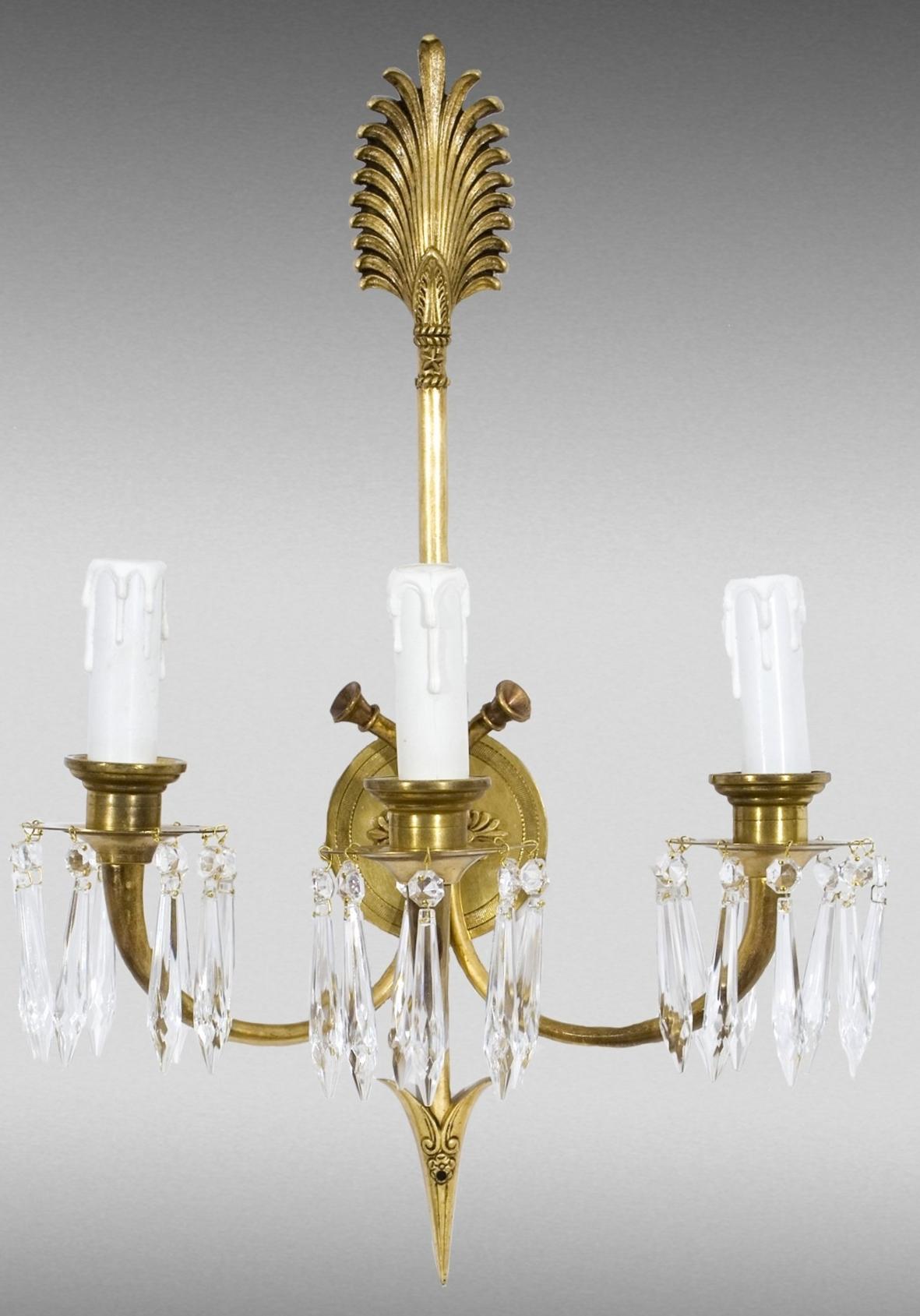 Pair of appliques. Bronze, glass. Empire style, France, circa 1900.
 Both are practically the same, each wall light has three points of light and a decoration and lines that respond to the classicist influence of the style to which they belong.