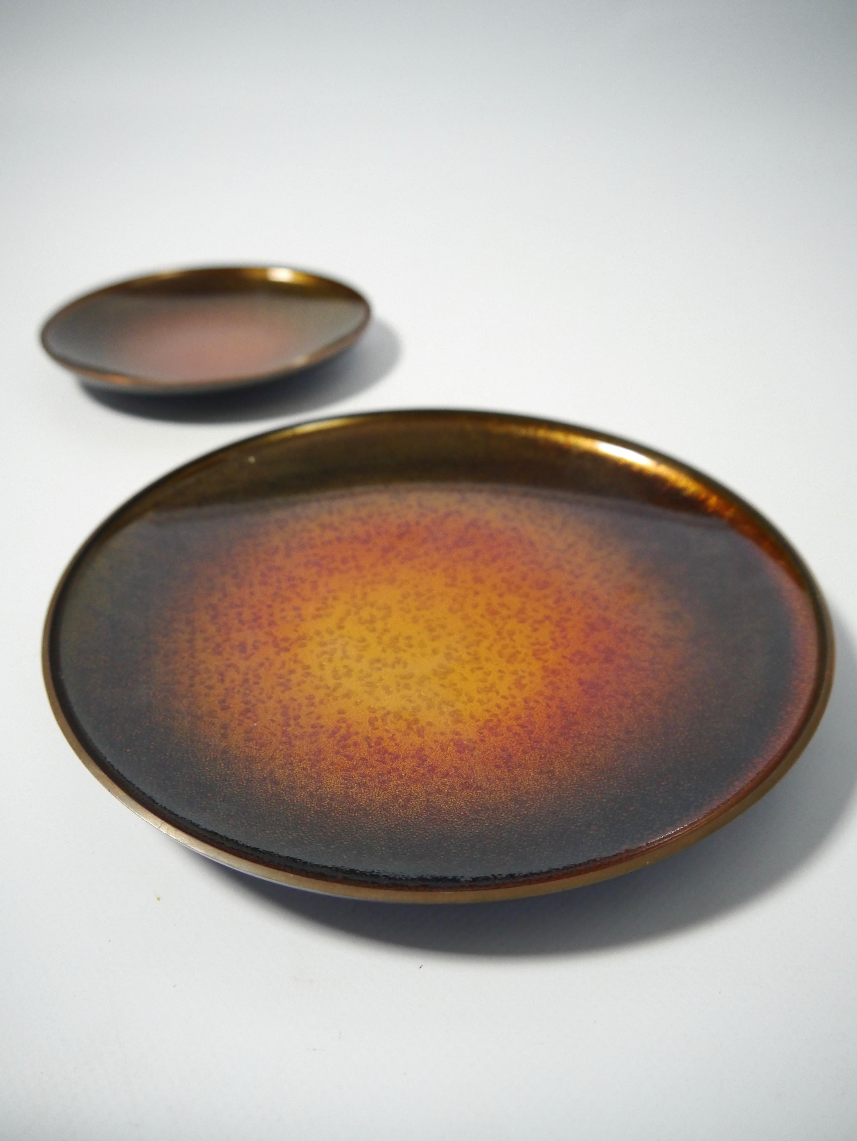 Two trays / plates enamel over copper, by David Andersen 1960s. Big plate has hanging device on back.