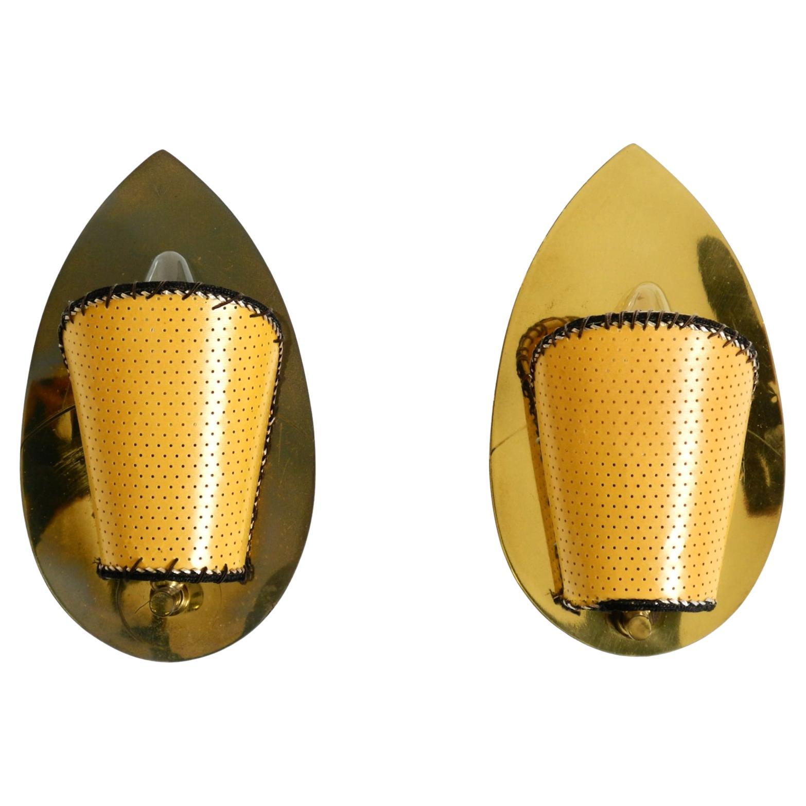 Two enchanting original Mid Century Modern brass wall lamps