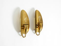 Two enchanting original Swedish Mid Century Modern brass wall lamps