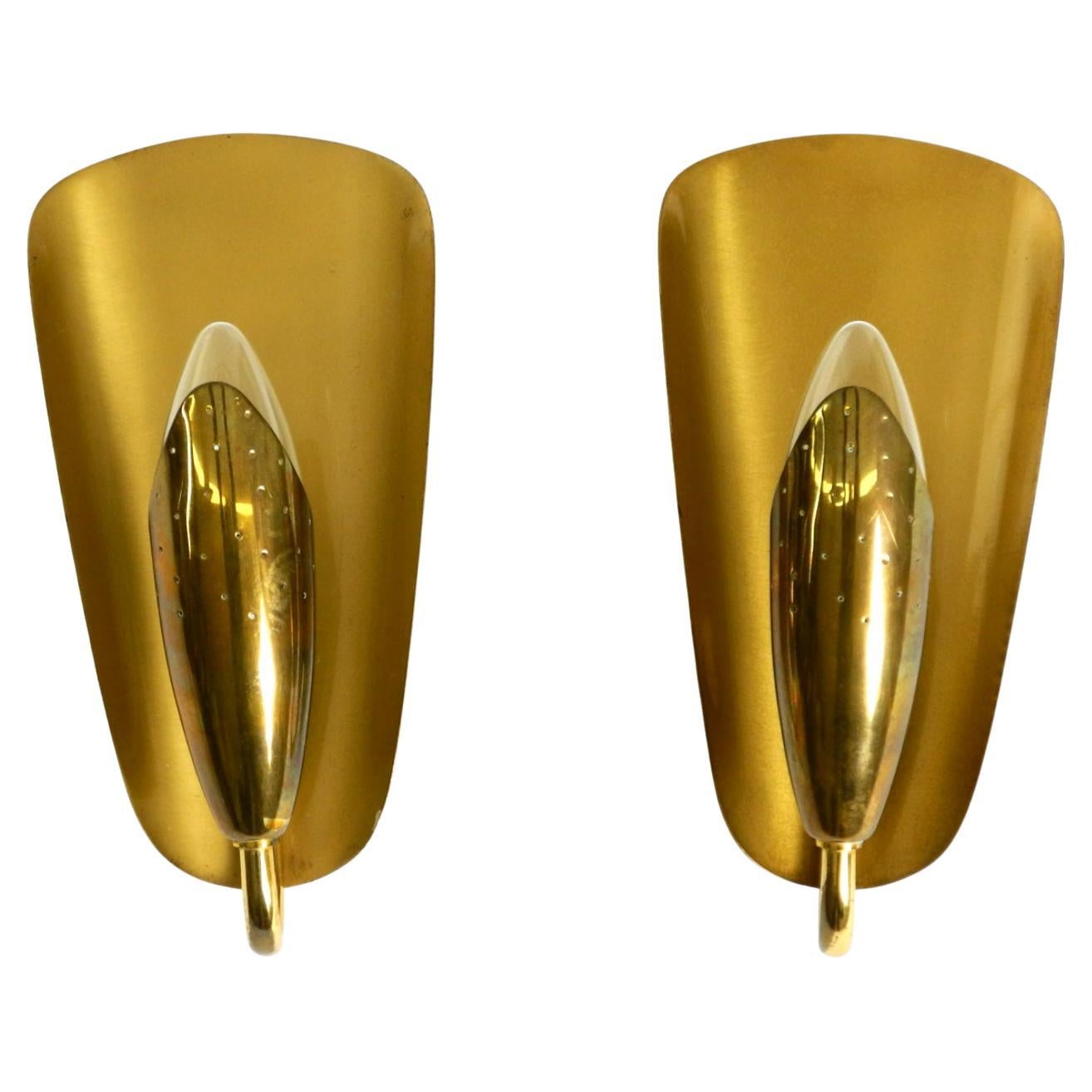 Two enchanting original Swedish Mid Century Modern brass wall lamps