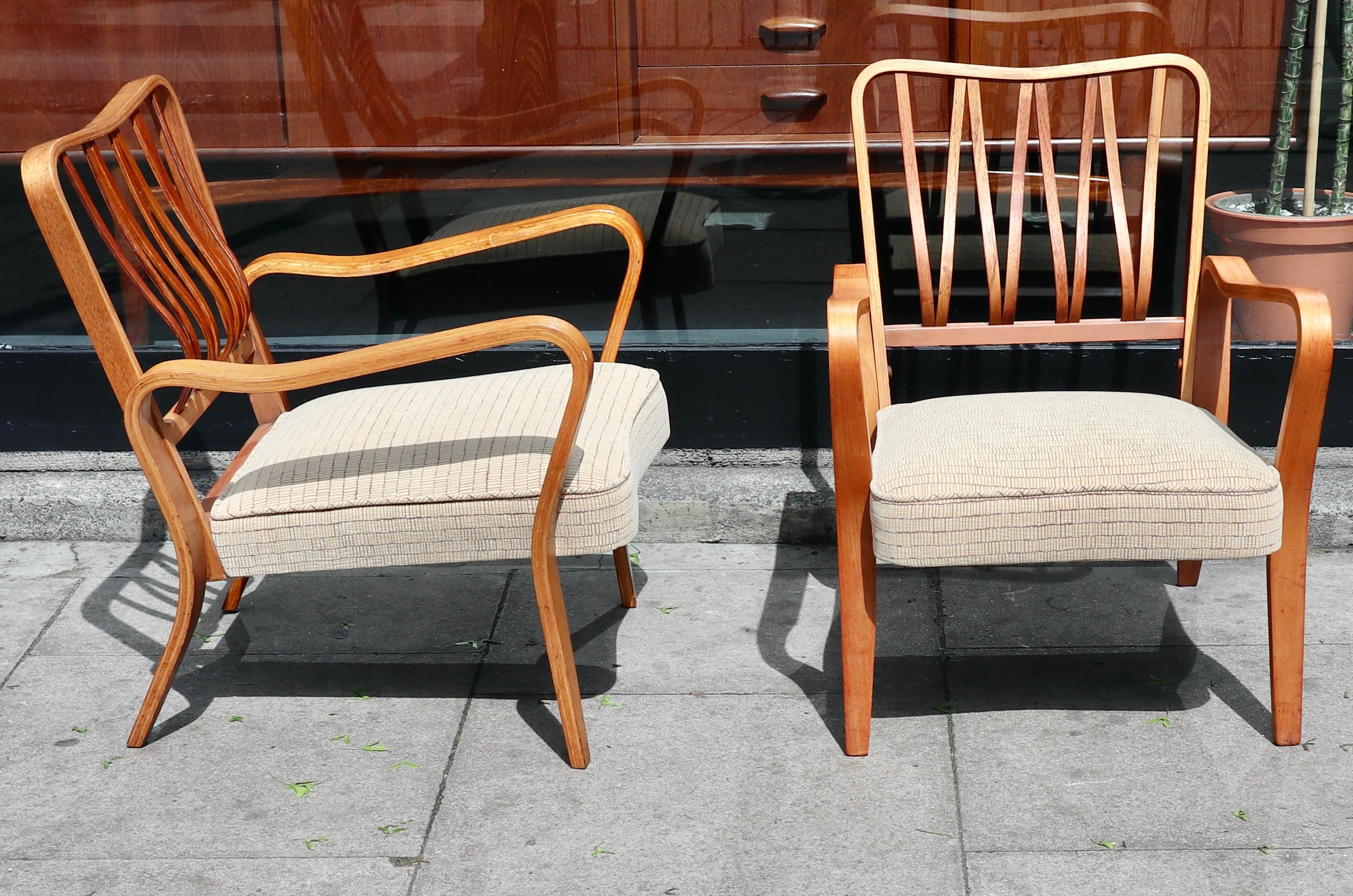 Two very rare and stylish early production modernist 'linden' armchairs, designed by G.A Jenkins/Eric Lyons in 1948 as part of the Tectra range, and manufactured by English company 'Packet'.
These two bent ply beech framed chairs are in very good
