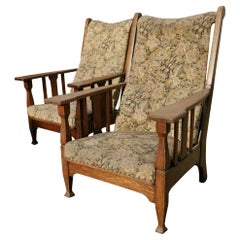 Two English Arts & Crafts Oak Reclining Armchairs with Large Flat Extended Arms