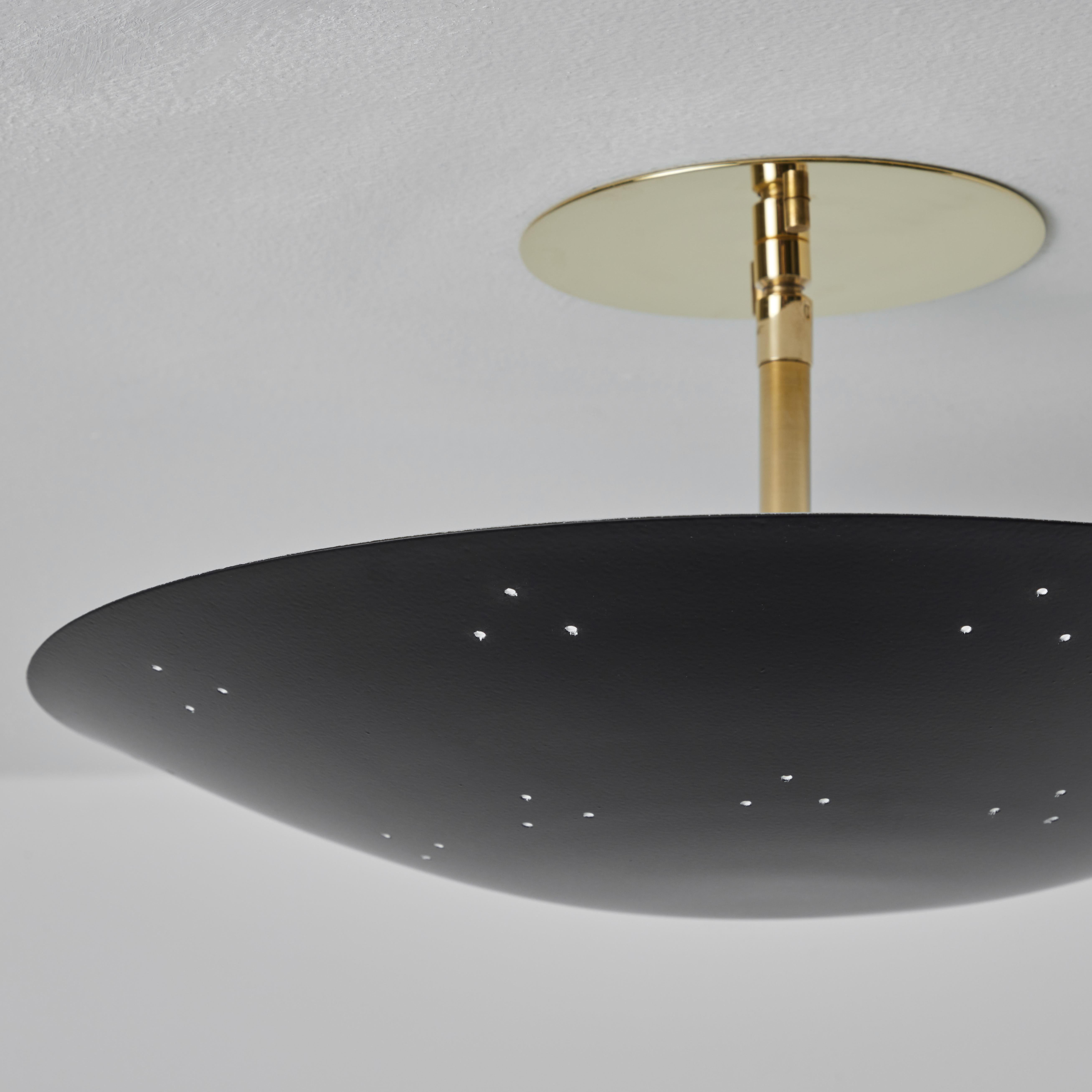 Two Enlighten 'Rey' Perforated Metal Dome ceiling lamp in Black. 
Hand-fabricated in Los Angeles, these highly refined ceiling lamps are reminiscent of the iconic mid-century Finnish designs of Paavo Tynell and Lisa Johansson Pape. Executed in black