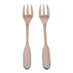 Two Evald Nielsen Number 14, oyster Forks in Hammered Silver, 1920s