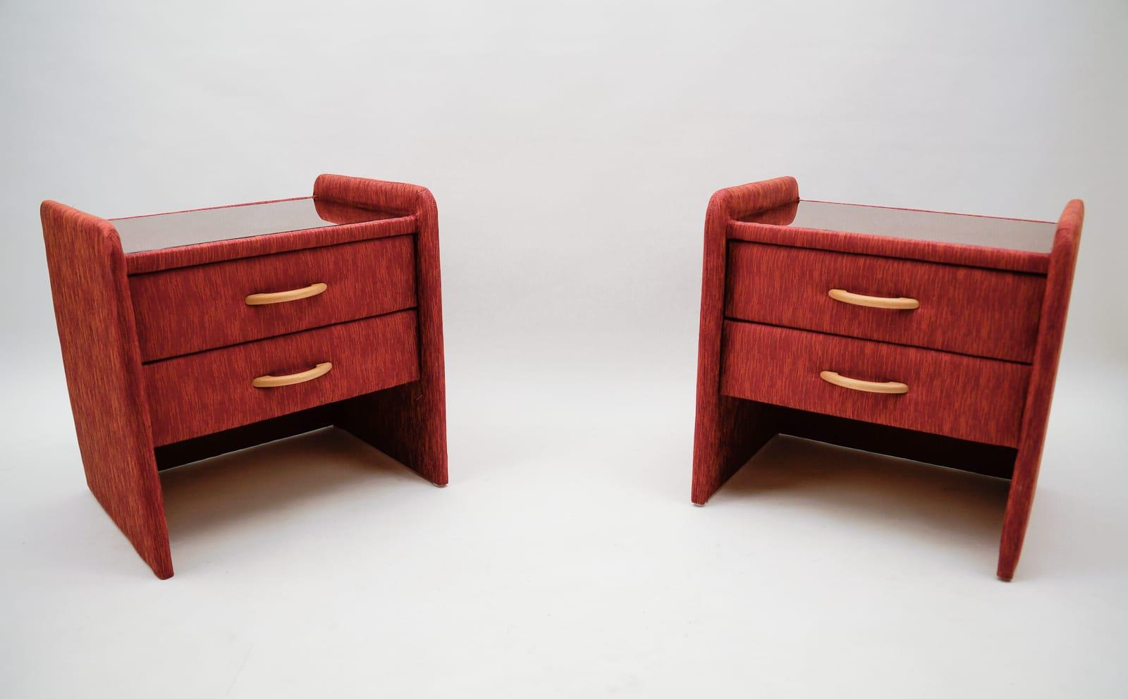 Two fabric upholstered bedside cabinets in light cherry red and glass.
 
  