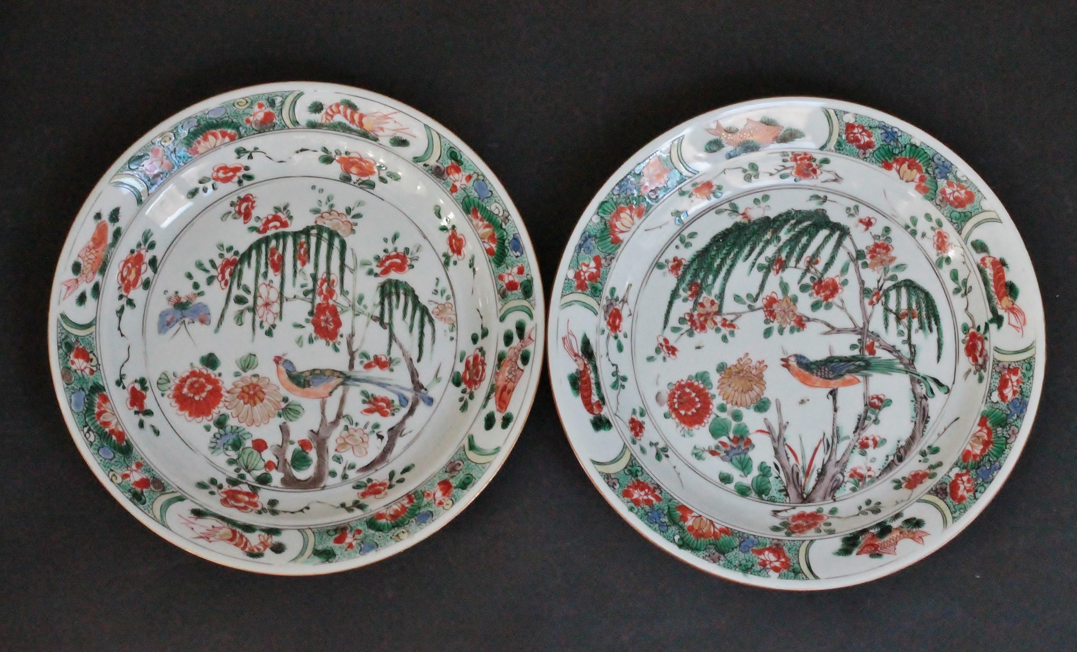 Two plates in China porcelain decorated with Famille Verte enamels of a bird on a tree, fish and prawns in reserves on the border.
Mark of double circle at the back.
Kangxi Period (1662-1722). 18th century.
Measures: Diameter 24 cm, Height 3
