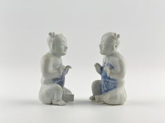 Two Miniature Figurine of Seated Boys, Circa 1725, Qing Dynasty, Yongzheng Reign