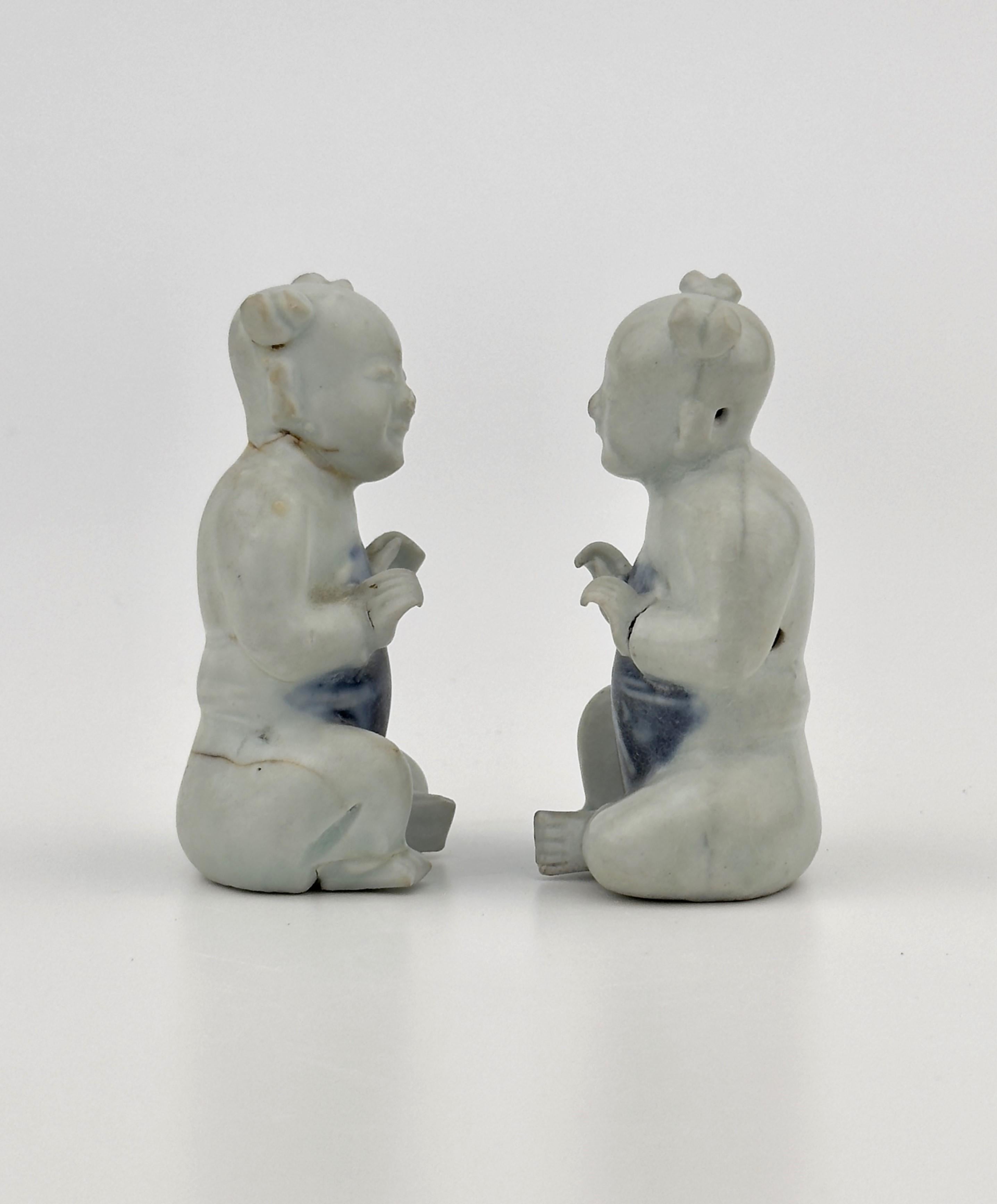 Chinese Two Figurine of Seated Boys, Circa 1725, Qing Dynasty, Yongzheng Reign For Sale