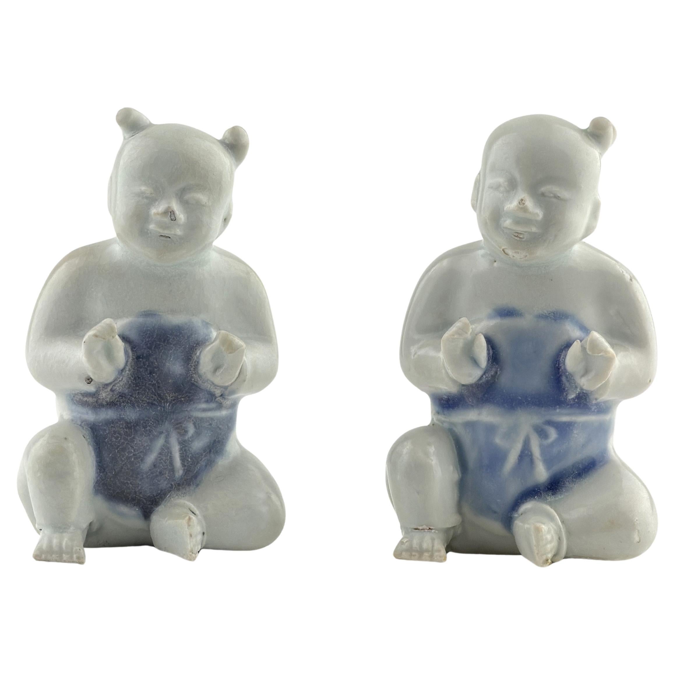 Two Miniature Figurine of Seated Boys, Circa 1725, Qing Dynasty, Yongzheng Reign For Sale