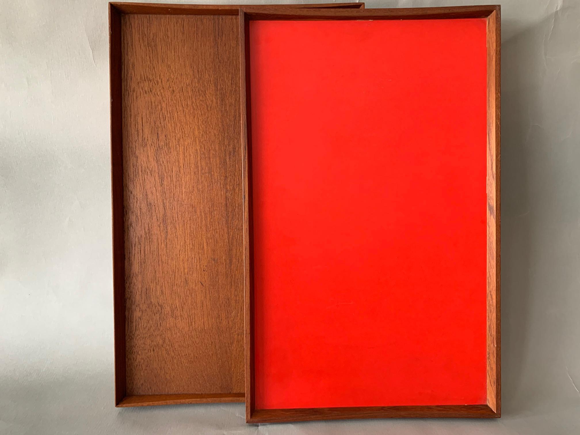 Two trays-one reversible red/black the other all teak designed by Finn Juhl for Torben Orskov, circa late 1950s. Not that they are slightly different sizes, one is marked 