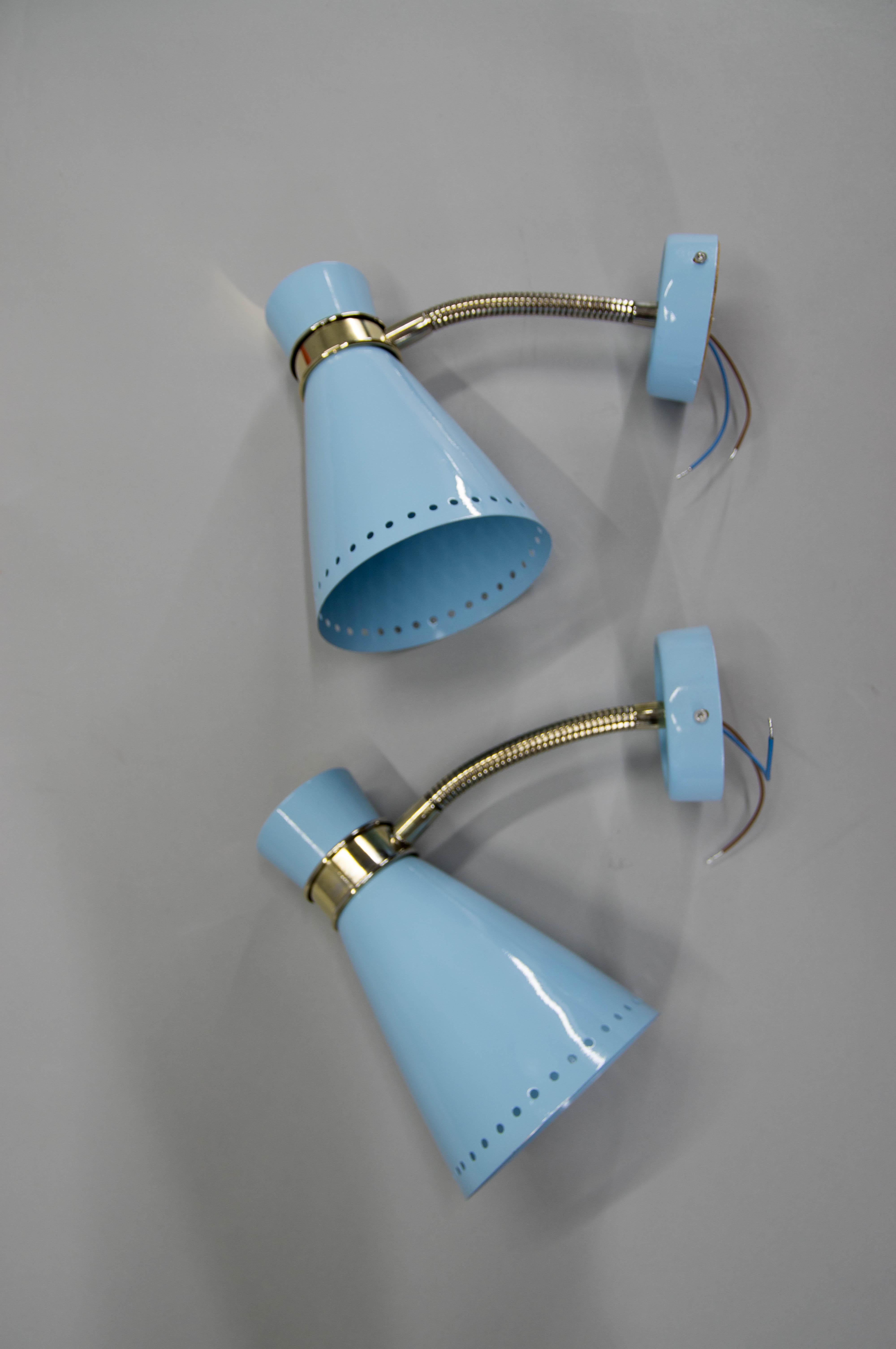 Made by Napako in 1960s. Can be used as bedside wall lamps. Flexible brass arms. Completely restored, light blue paint. Each lamp has its own switch on a top.
One lamp has a small defect on a side of a wall plate visible on picture.
Rewired: 1x40W,