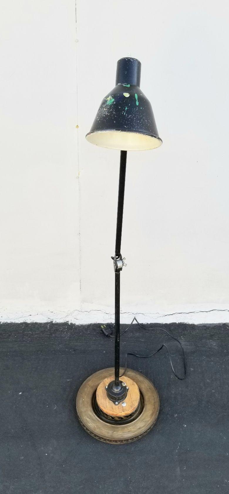 Pair of Industrial floor lamps buy Gimo Fero. Floor lamps are not identical but definitely a pair. Lamp stand is adjustable on the 3 placeless.