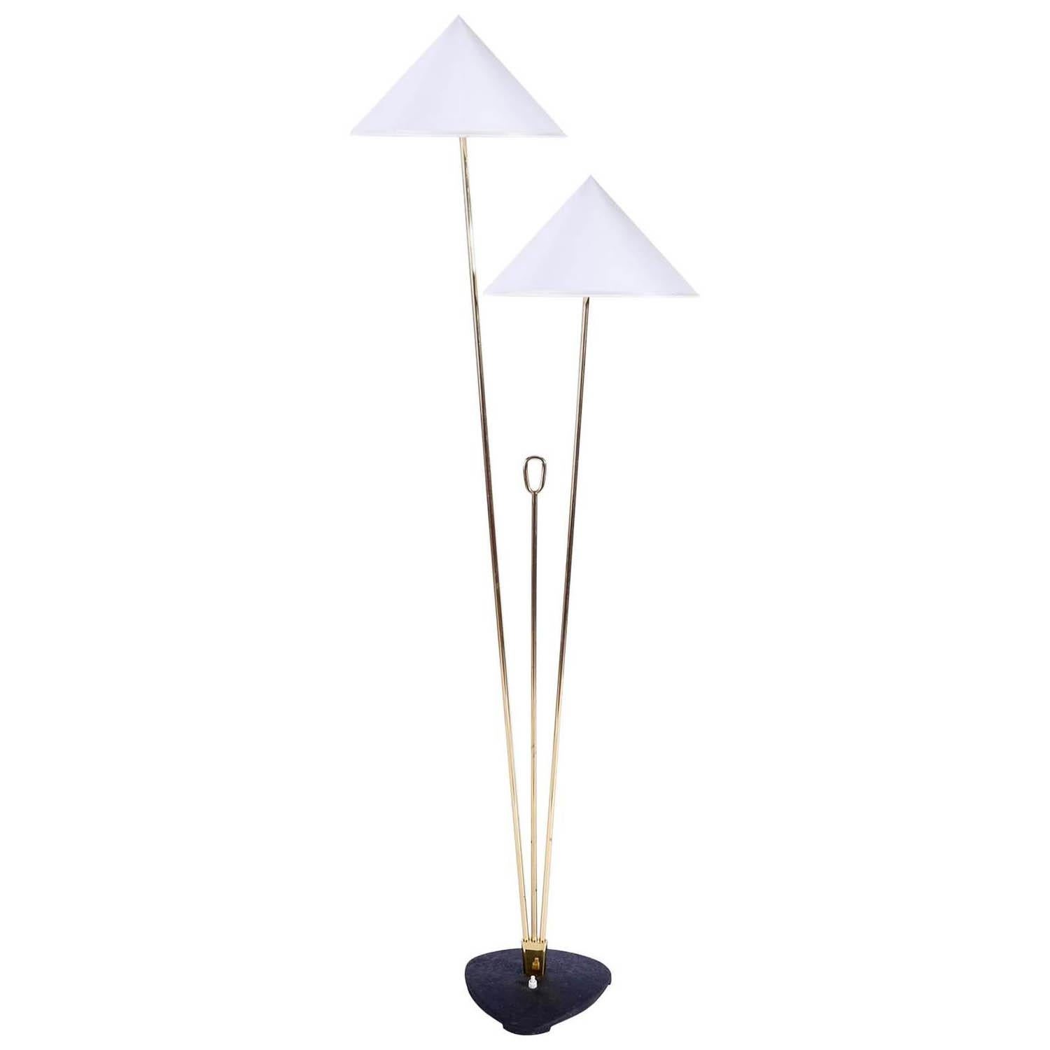 Two brass floor lamps with cone shaped lampshades by Rupert Nikoll, Vienna, Austria, manufactured in midcentury, circa 1960 (late 1950s or early 1960s). 
The stand is made of two brass rods in different lengths, a shorter brass rod with a handle,