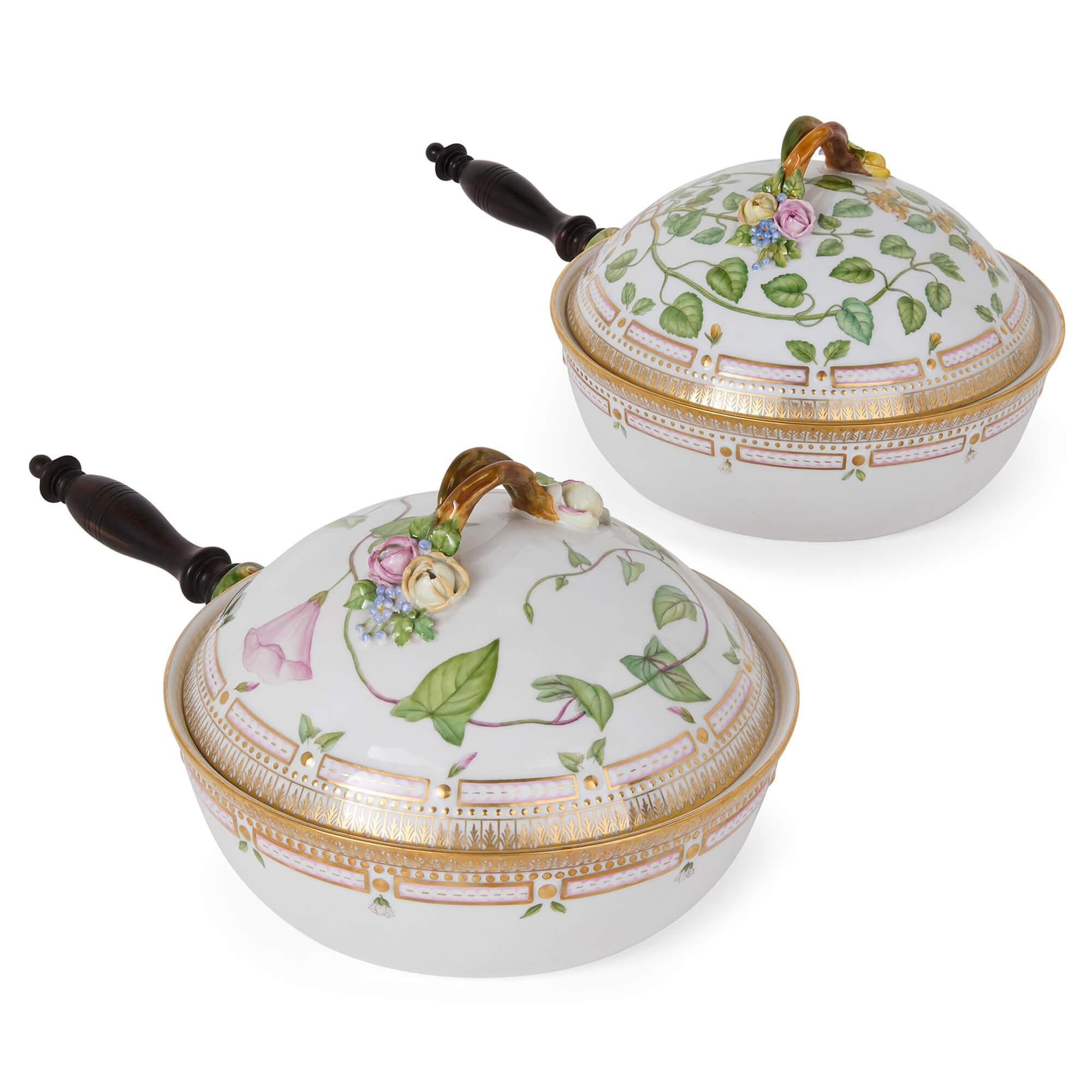 Two Flora Danica Royal Copenhagen Danish Porcelain Dishes Handles 
Danish, 20th Century 
Height 16cm, width 40cm, depth 24cm

These refined dishes are part of the celebrated Flora Danica porcelain collection, produced by Denmark’s Royal Copenhagen