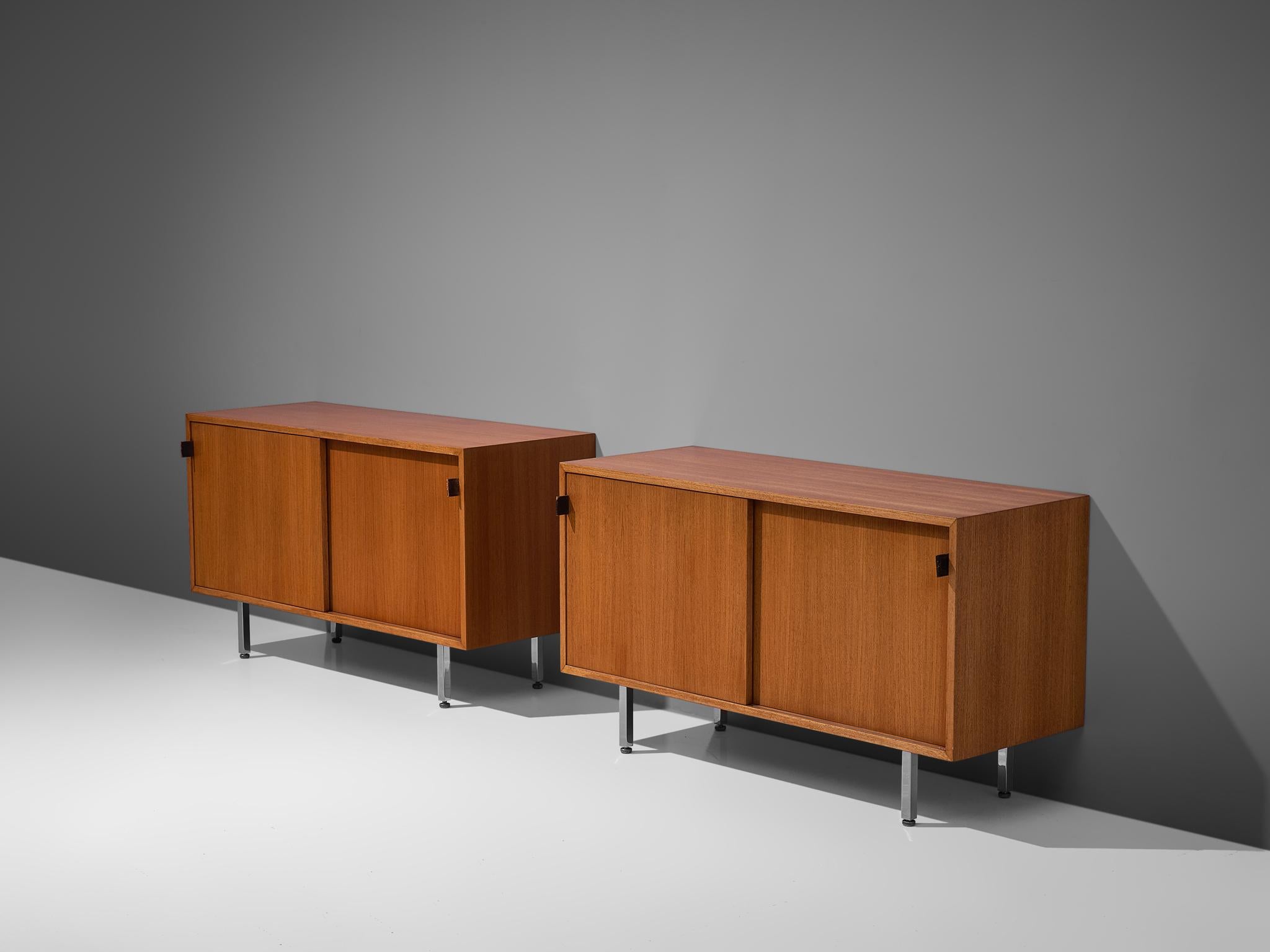 Florence Knoll for Knoll International, sideboard, walnut, steel and leather, United States, 1948.

Two early office-residential crossover pieces. The small walnut sideboards have two sliding doors. Inside there are several shelves for plenty of