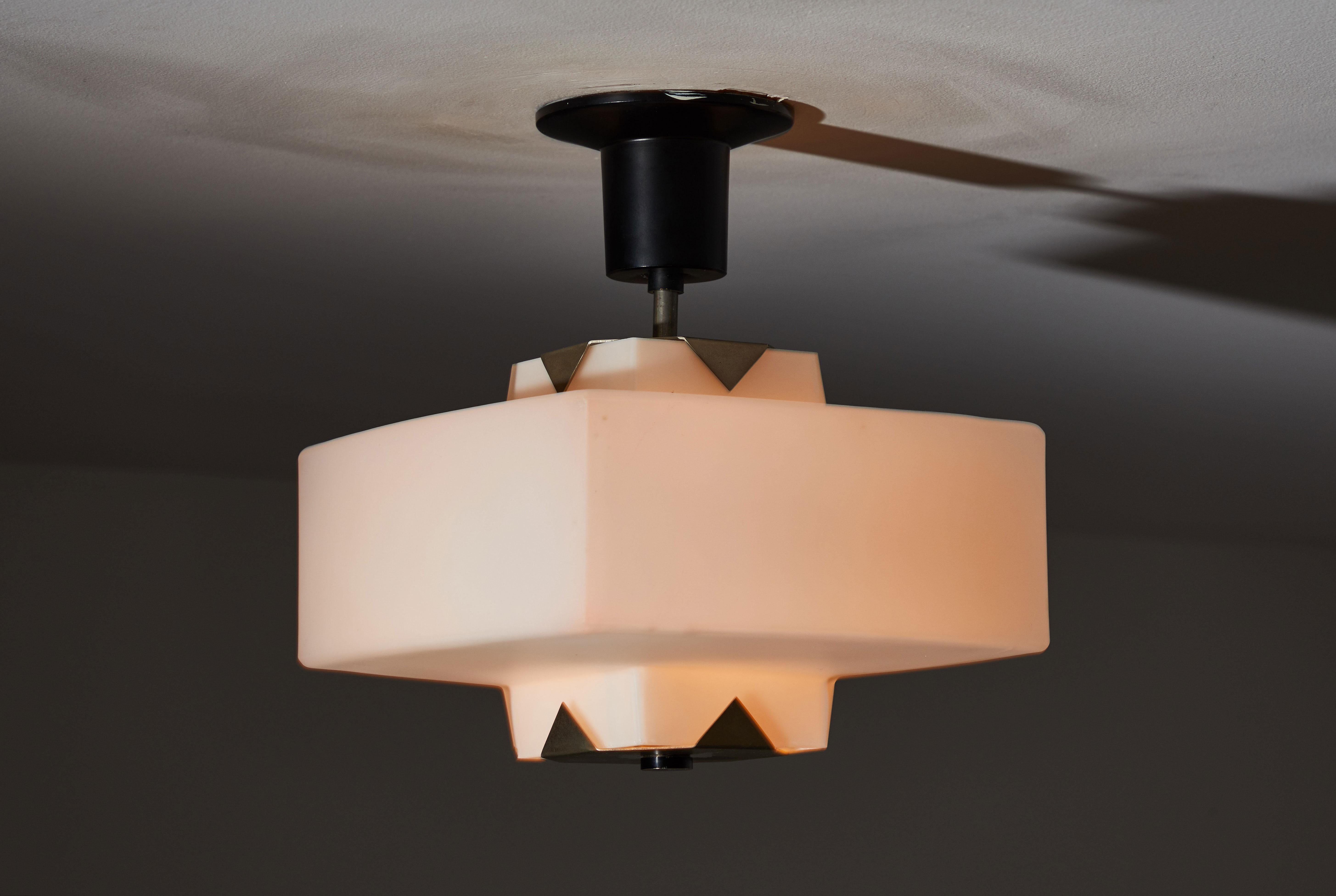 Single Flush Mount ceiling light by Arredoluce. Manufactured in Italy, circa 1960s. Brushed satin glass diffusers, brass hardware, original enameled metal canopy and ceiling plate. Rewired for US junction boxes. Takes one E27 100w maximum bulb. 