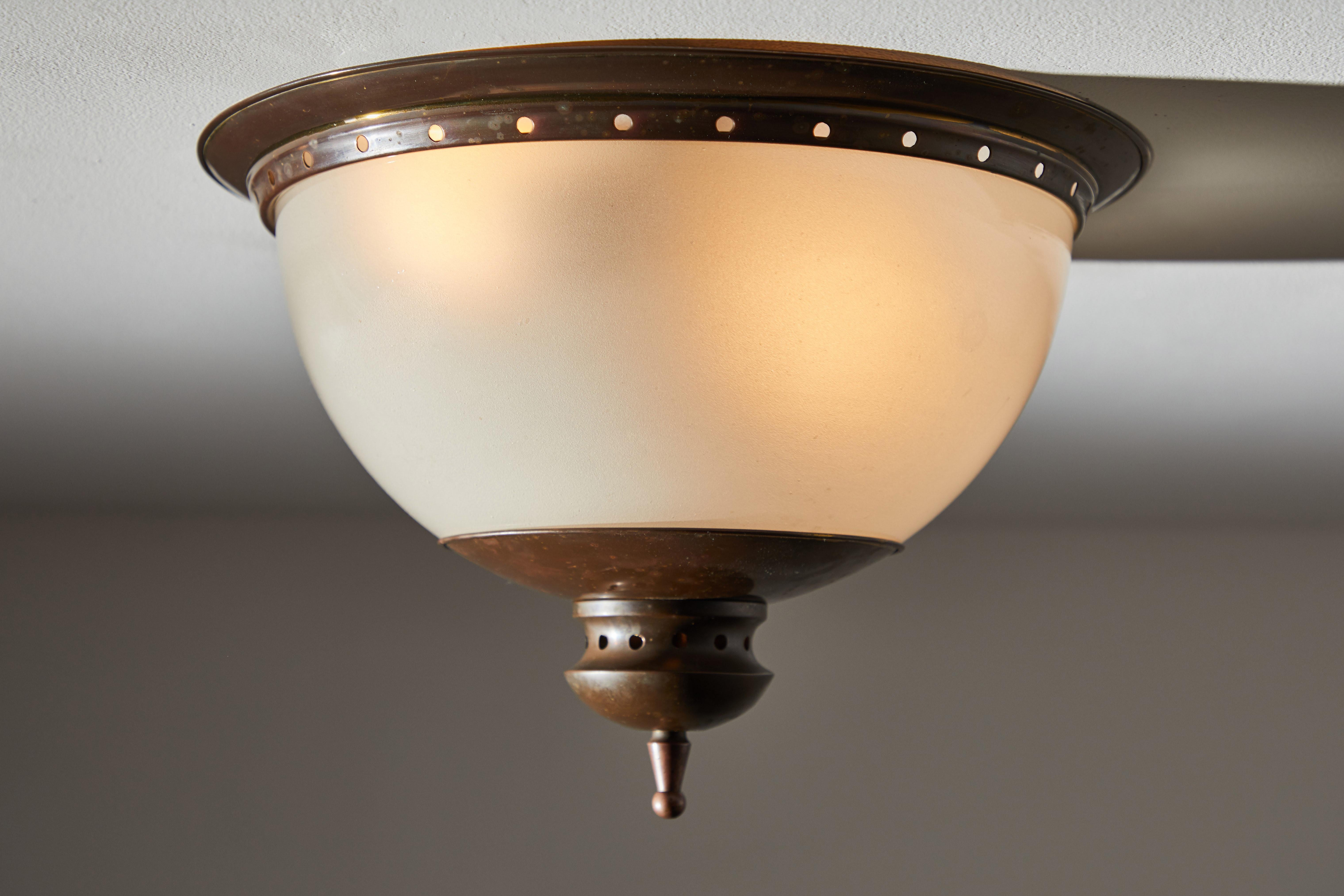 Two flush mount ceiling lights by Caccia Dominioni for Azucena. Designed and manufactured in Italy, circa 1950s. Pewter plated brass, opaline glass. Rewired for U.S. Junction boxes. Each light takes two E27 75w maximum bulbs. Bulbs provided as a