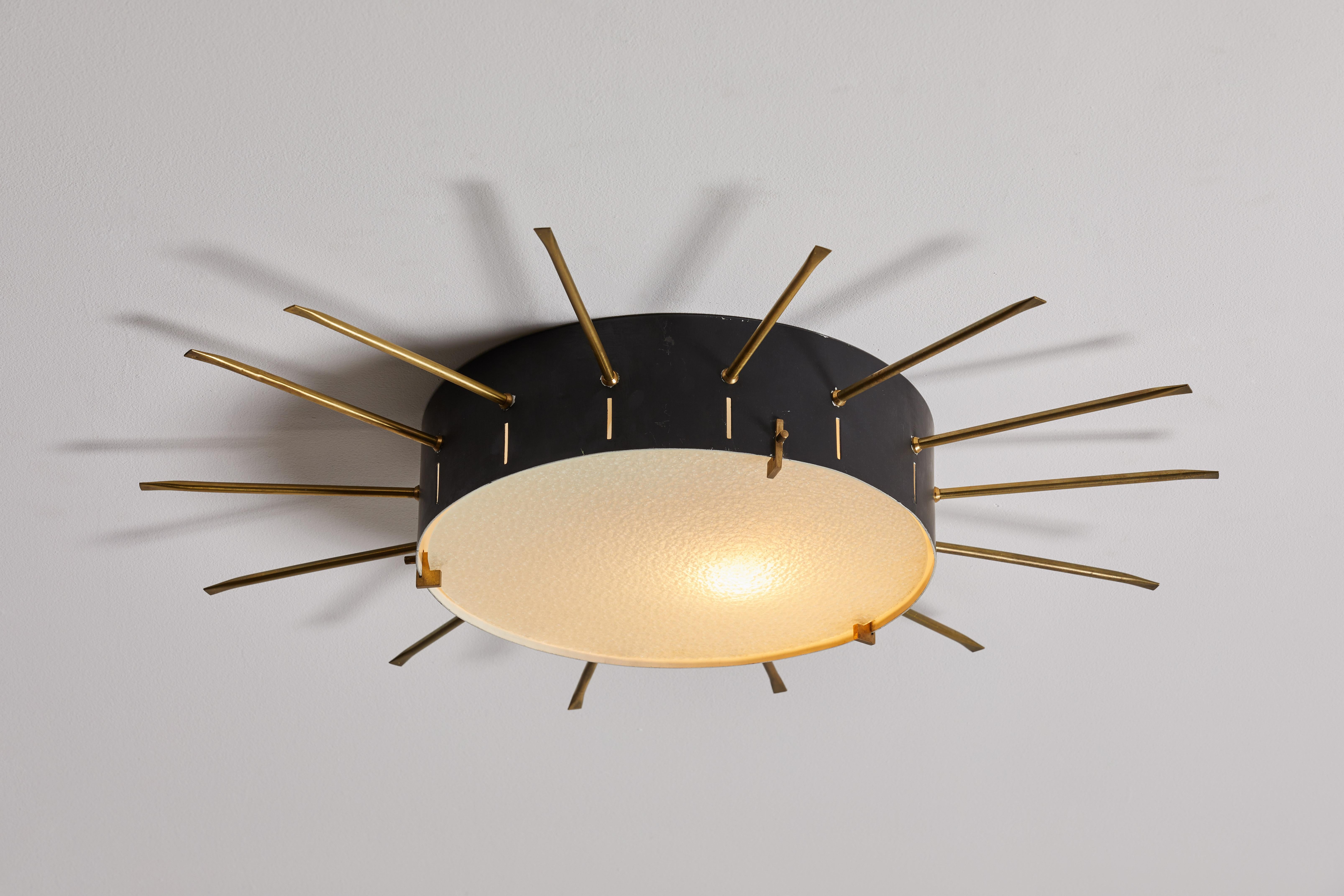 Single flush mount ceiling lights by G.C.M.E. manufactured in Italy, 1955. Enameled aluminum, textured glass diffusers, brass. Rewired for U.S. junction boxes. Each light takes two E27 60w maximum bulbs. Bulbs provided as a one time courtesy. Priced