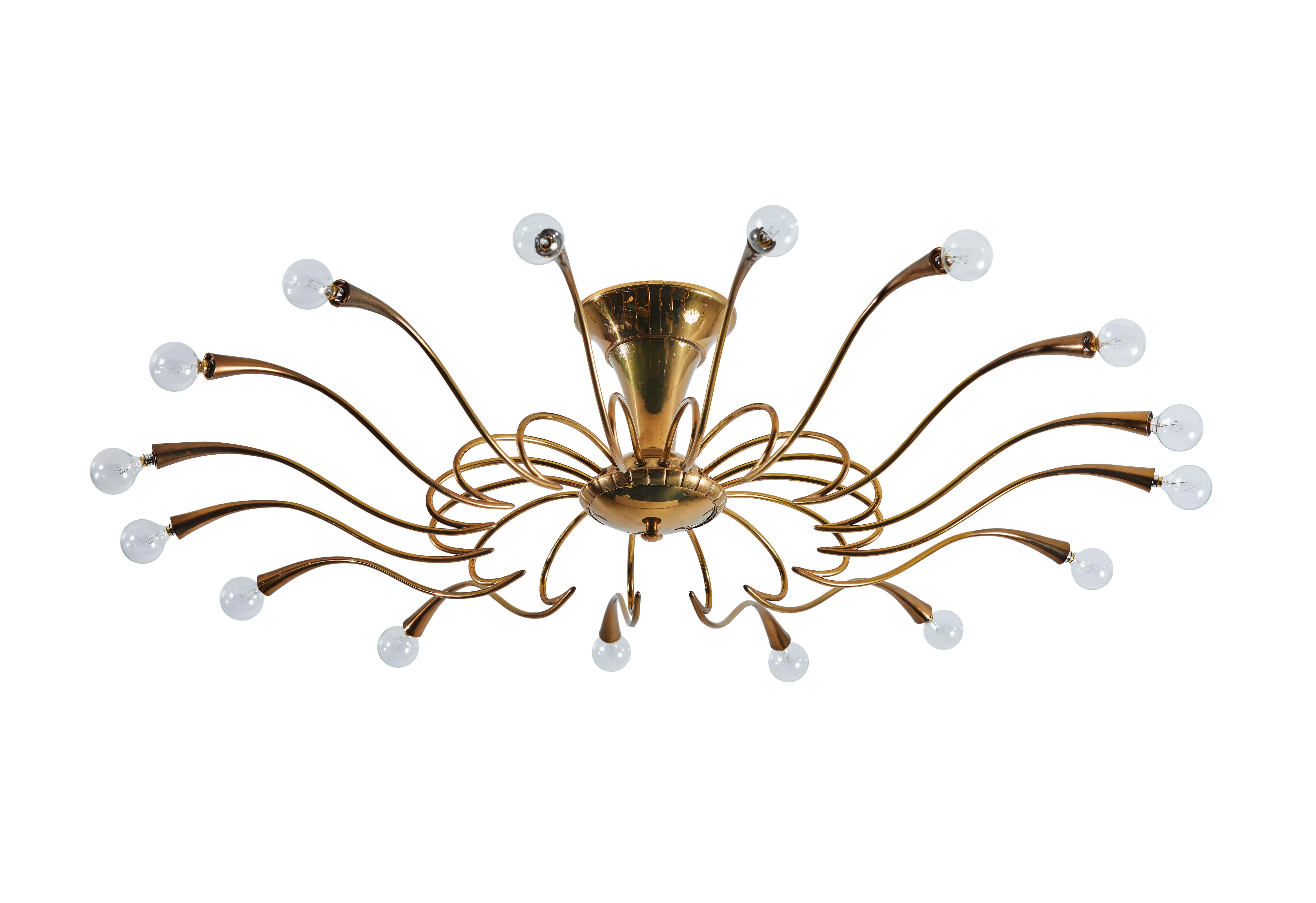 One flush mount chandeliers by Oscar Torlasco. Designed and manufactured in Italy, circa 1950s. Brass. Rewired for U.S. junction boxes. Takes sixteen E27 European candelabra 25w maximum bulbs. Bulbs provided as a onetime courtesy. Priced and sold