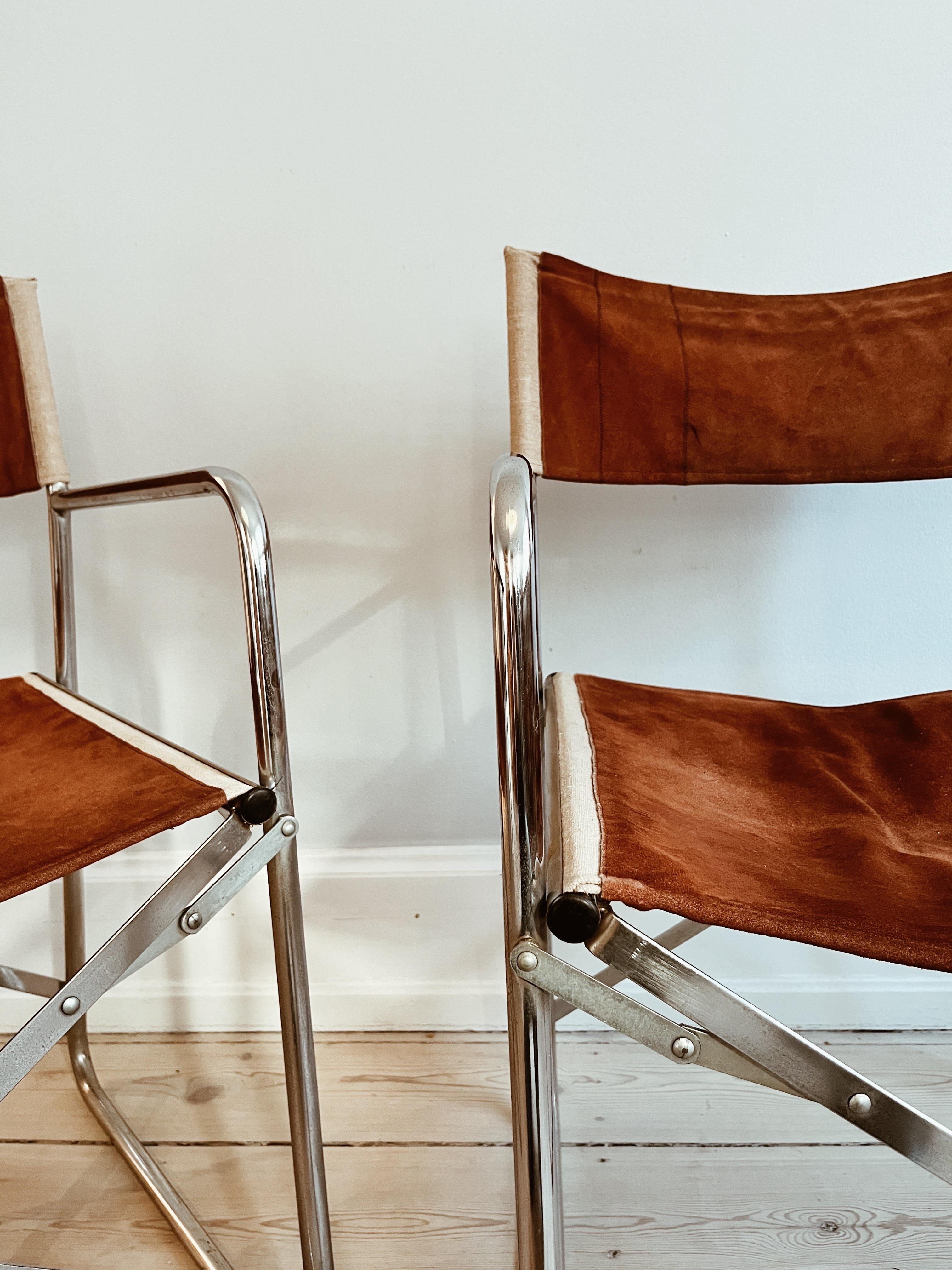 Modern Two folding chairs in chrome and chokolate colored suede