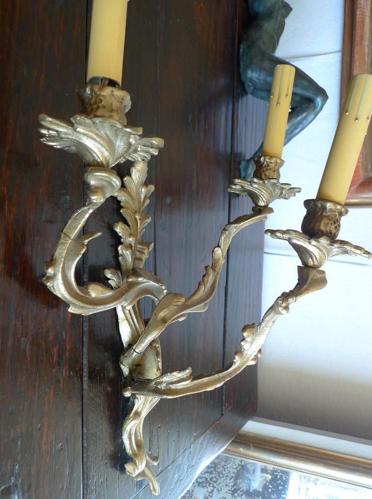Two French 19th Century Solid Bronze Three-Light Sconces In Distressed Condition For Sale In Santa Monica, CA