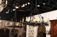 Two French Circular 12-Light Iron Chandeliers with S-Scrolls from the 1890s