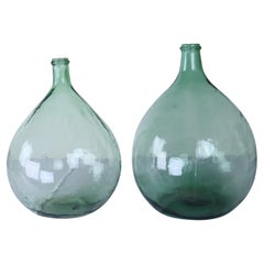 Two French Green Glass Demijohn Bottles