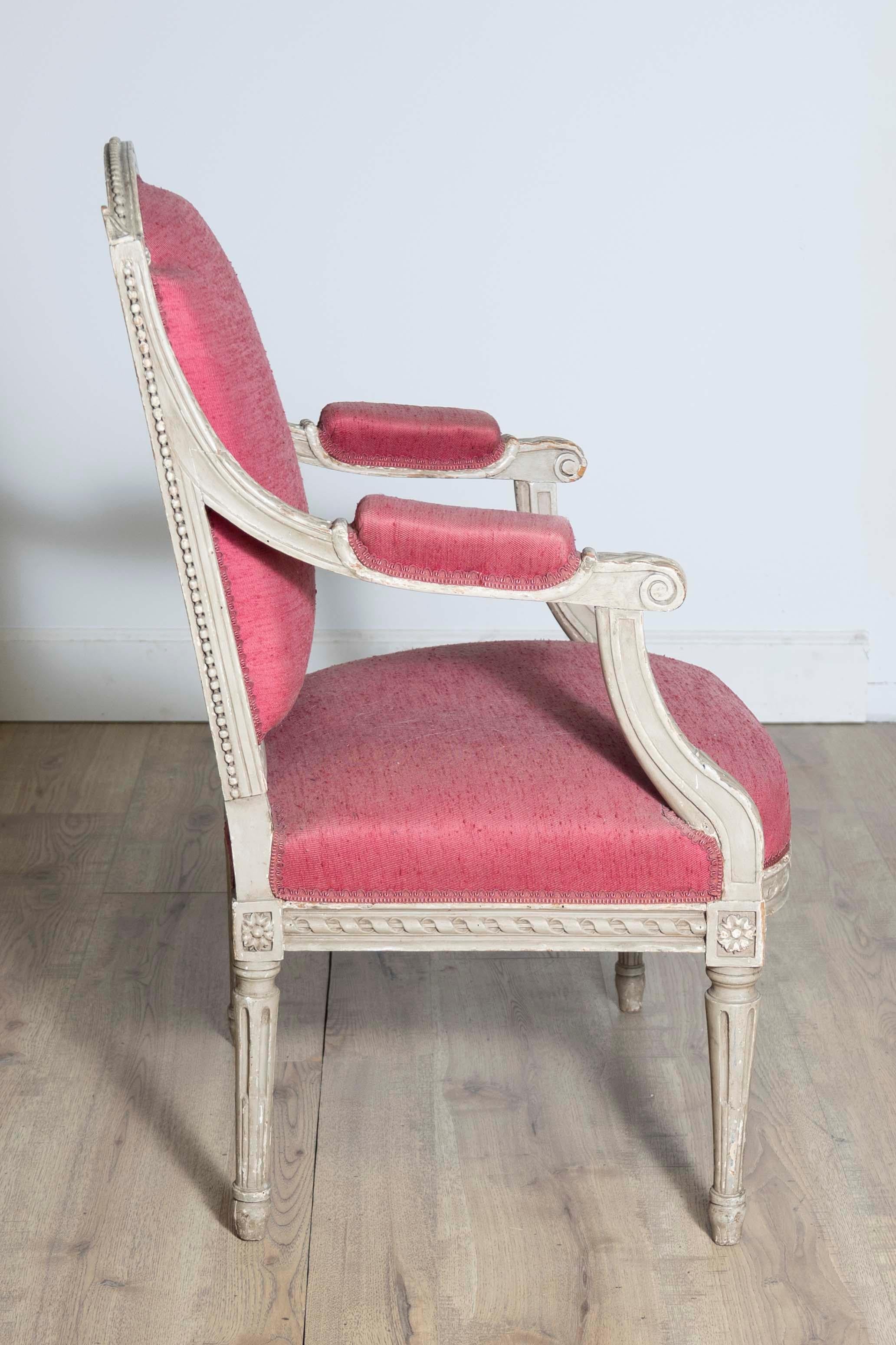 Upholstery Two French Louis XVI Style Painted Armchairs with Richly Carved Décor, Sold Each For Sale