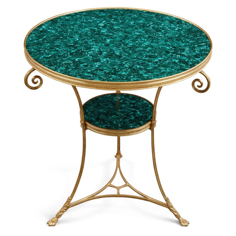 Two French malachite and gilt bronze circular side tables 
French, c. 1900 
Height 69cm, diameter 62cm 

These elegant circular side tables (French: ‘guéridons’) were crafted in France in the early 20th Century, c.1900. Owing to their refined