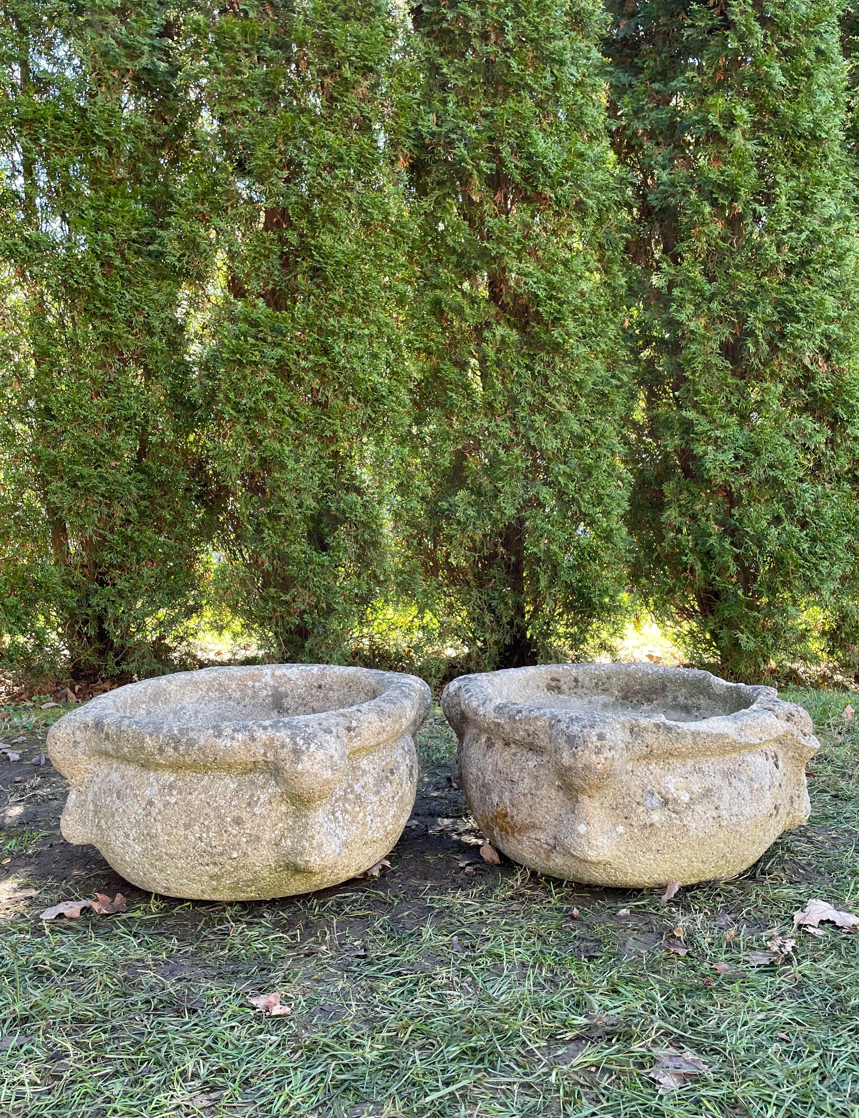 We love the form, size, and weathered patina on these cast stone vessels and, because pieces that can be used as sinks are always in great demand, we are selling them separately. Both are in excellent condition, but one has two lightly-weathered and
