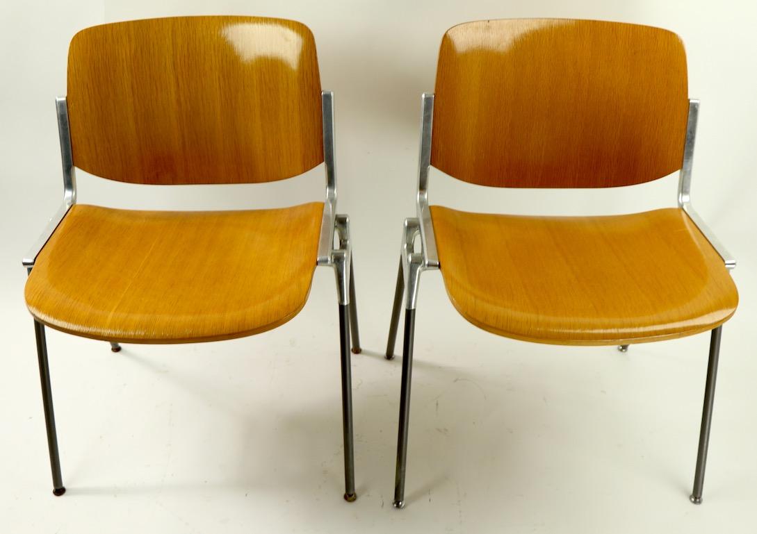 Exceptional design, quality and craftsmanship, pair of Piretti for Castelli stackable chairs, in very good original condition. Classic Italian Modernist design, sturdy, chic and functional. Offered and priced individually, however we would love see