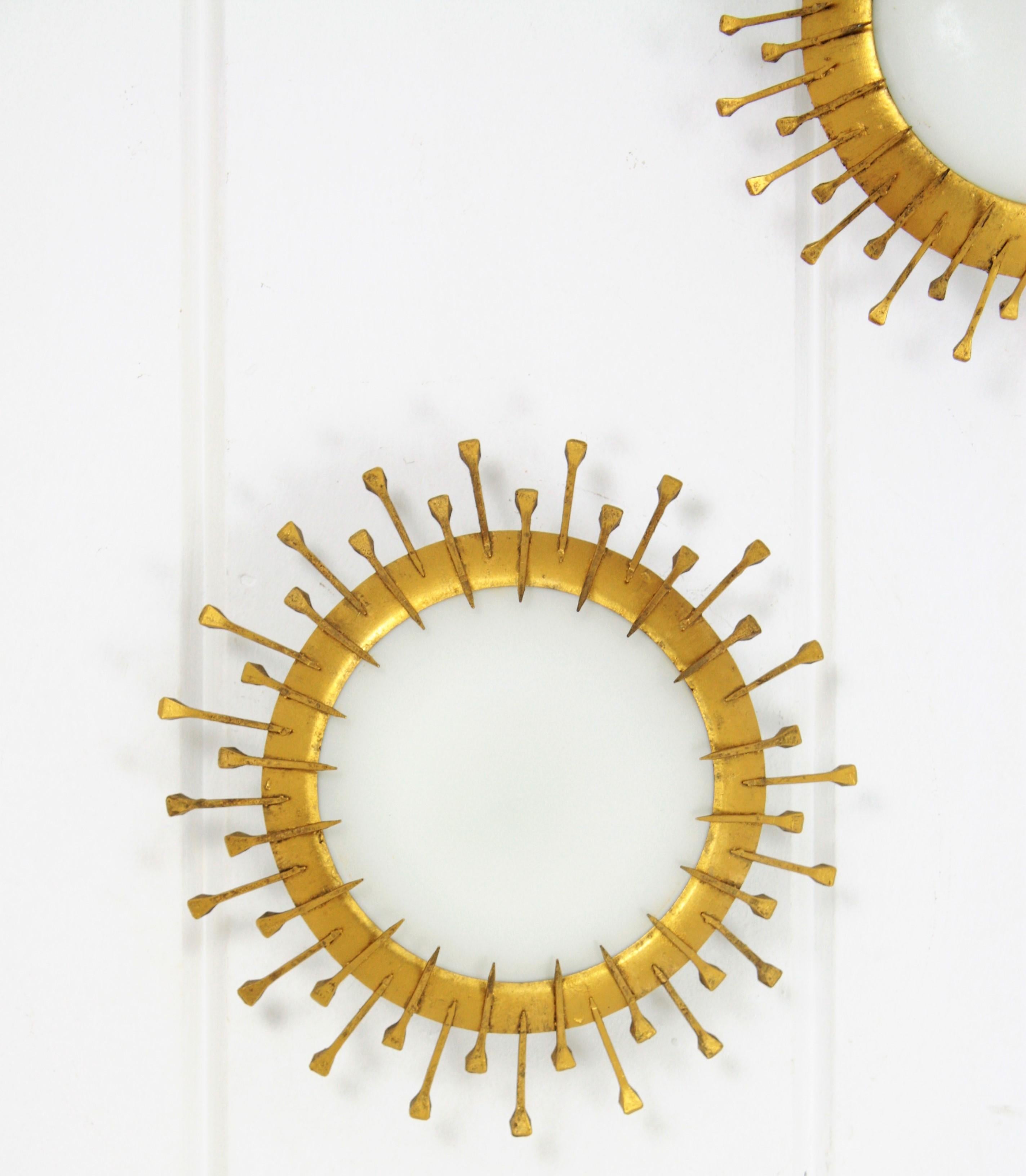 20th Century Two Gilt Iron Milk Glass Sunburst Light Fixtures with Nail Details, France 1940s