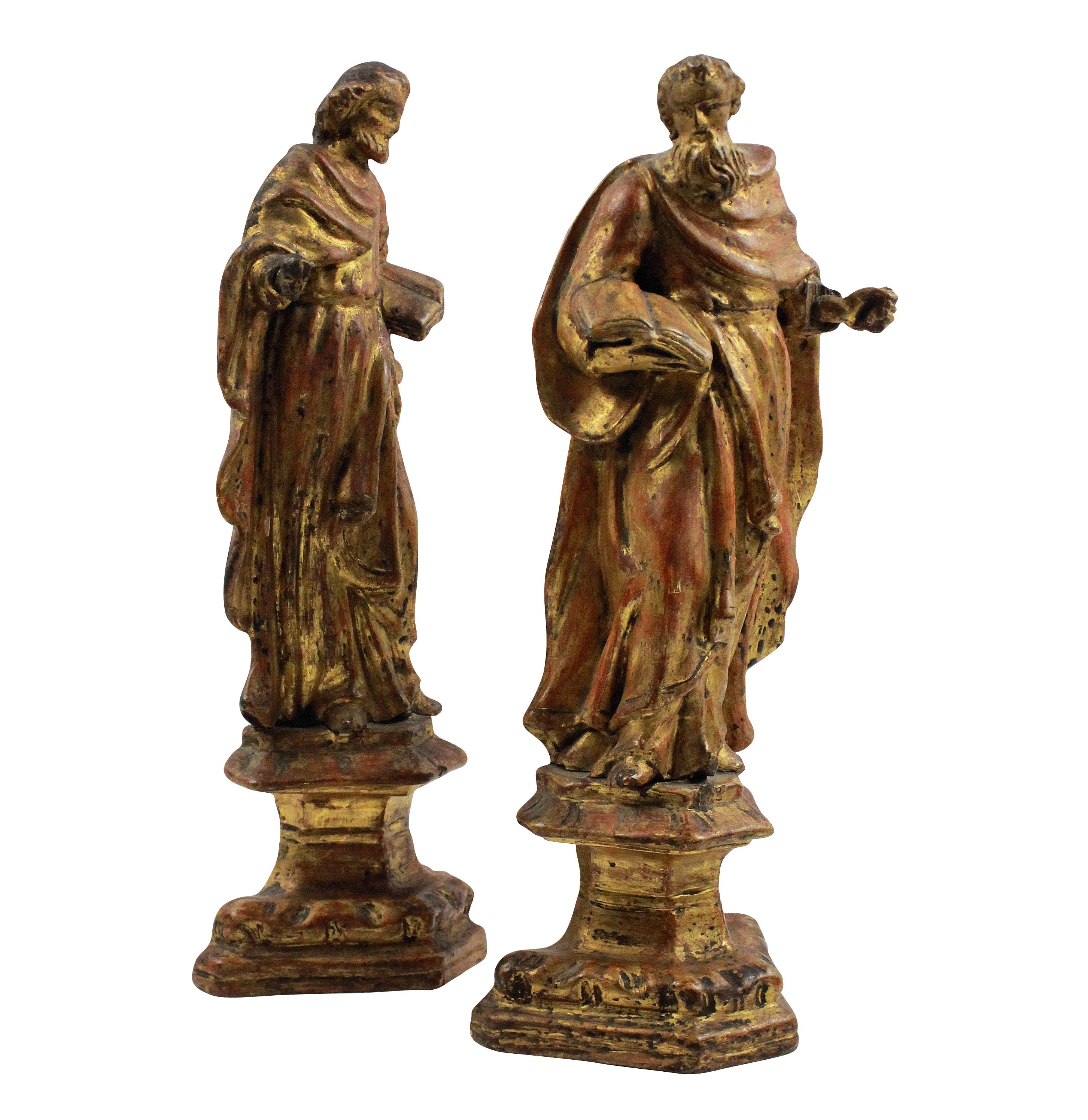 A pair of Italian 18th century giltwood figures of Saints Peter & Paul. In very good condition, apart from Peter having long lost his keys.