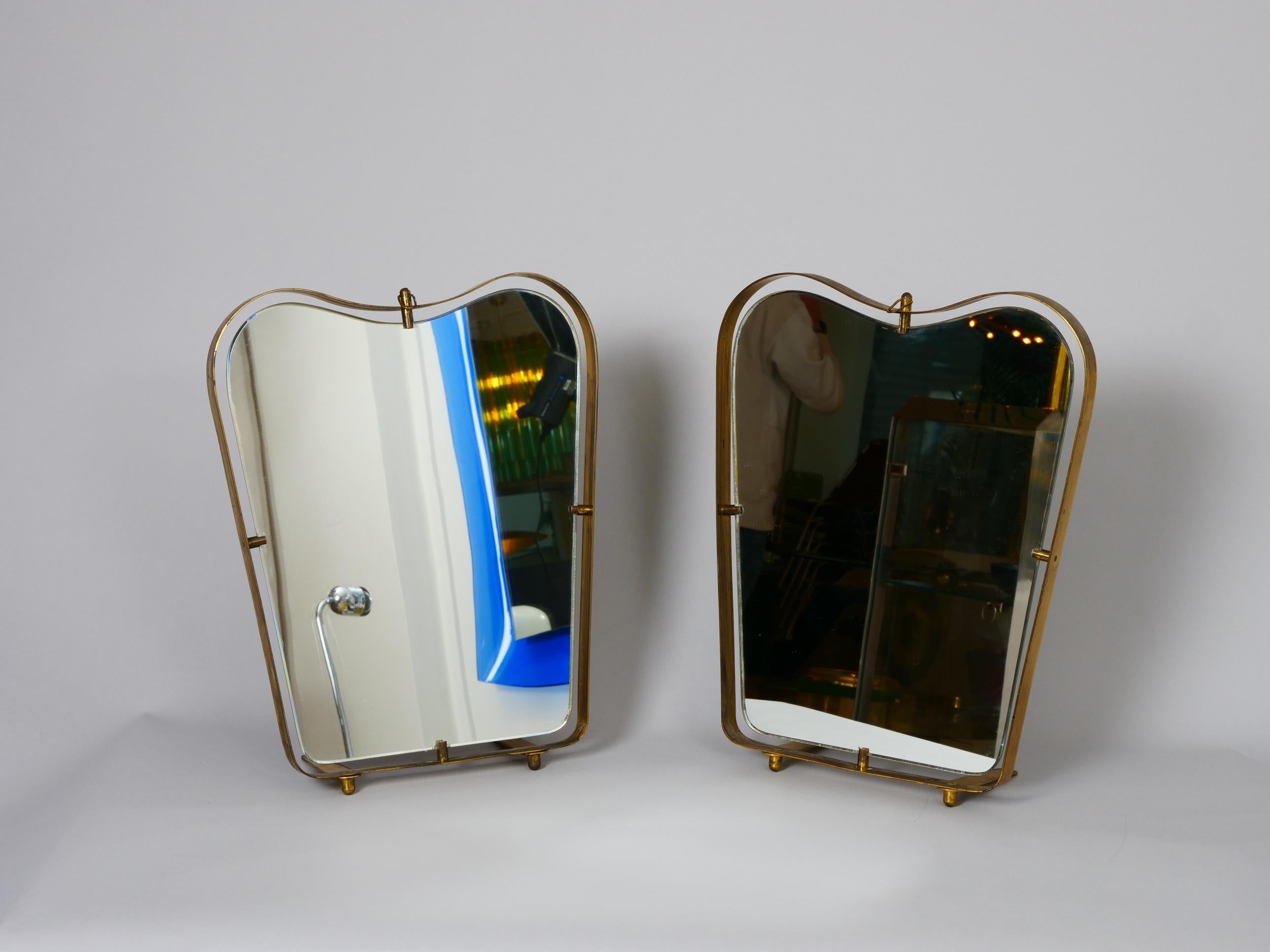 Two Gio Ponti shape Fontana Arte free standing table or wall mirrors. 

Italy c1950 in very good condition

Lovely patina to brass. Mirror in very good condition. Some age but no real blemish.
