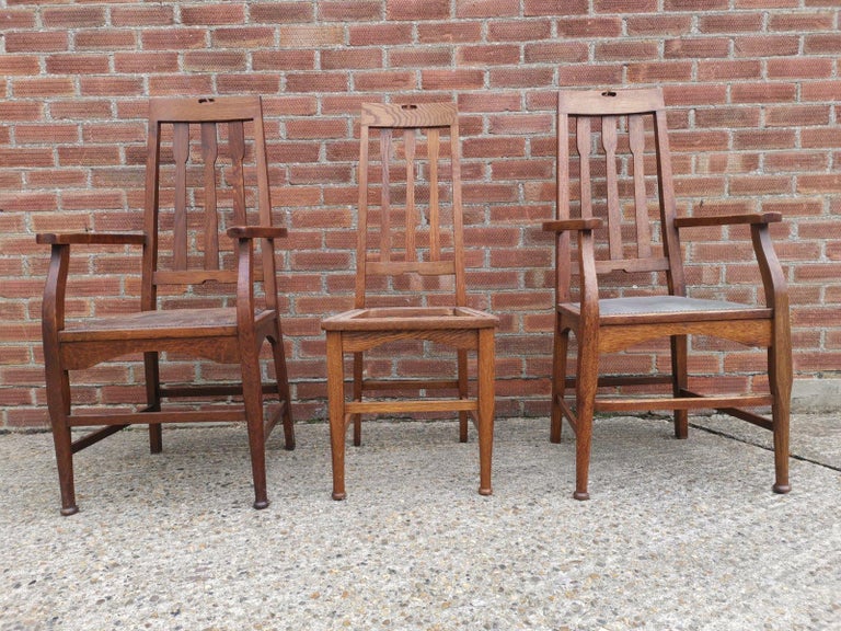 Two Glasgow Style Arts and Crafts Oak Armchairs and a Single Matching